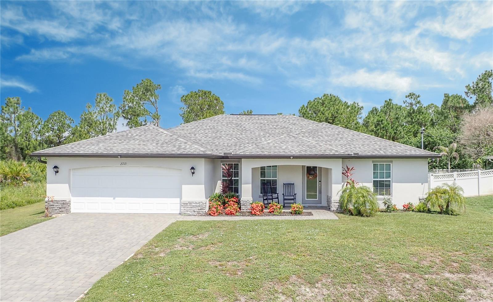 PLEASE SEE THE 3D INTERACTIVE TOUR! Welcome to this beautifully maintained 2023-built, 4-bedroom, 2-bath home located in North Port, offering over 1,800 square feet of comfortable living space. Designed with both style and functionality in mind, this home features ceramic tile flooring throughout and PGT impact-resistant windows for added peace of mind. The open floor plan is filled with natural light and centers around a spacious great room, creating an inviting space for everyday living and entertaining. The kitchen features wood cabinetry, granite countertops, stainless steel appliances, a center island, and a pantry for ample storage. Just off the kitchen, the inside laundry room includes an additional pantry/storage closet for even more convenience. A large dining area provides plenty of room for gatherings and entertaining family and friends. The spacious primary suite offers abundant natural light, two walk-in closets, and a private en suite bath with dual sinks and a tiled shower stall. Three additional bedrooms provide flexibility for family, guests, a home office, hobby room, or additional guest accommodations. Step outside and enjoy the Florida lifestyle from the screened-in lanai, perfect for morning coffee, relaxing evenings, or year-round outdoor enjoyment. The backyard offers plenty of possibilities, including space for a future pool. With its modern construction, impact-resistant windows, spacious layout, and versatile living spaces, this North Port home is ready to welcome its next owner!