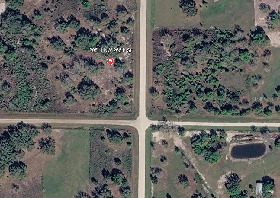 1.25-acre vacant residential corner lot located in a growing rural area of Okeechobee County. Property offers approximately 165 feet of road frontage per county GIS measurements. Ideal for a future homesite, manufactured home, or long-term investment. No improvements currently on site. Buyer to verify zoning, utilities, and all development requirements with the county.