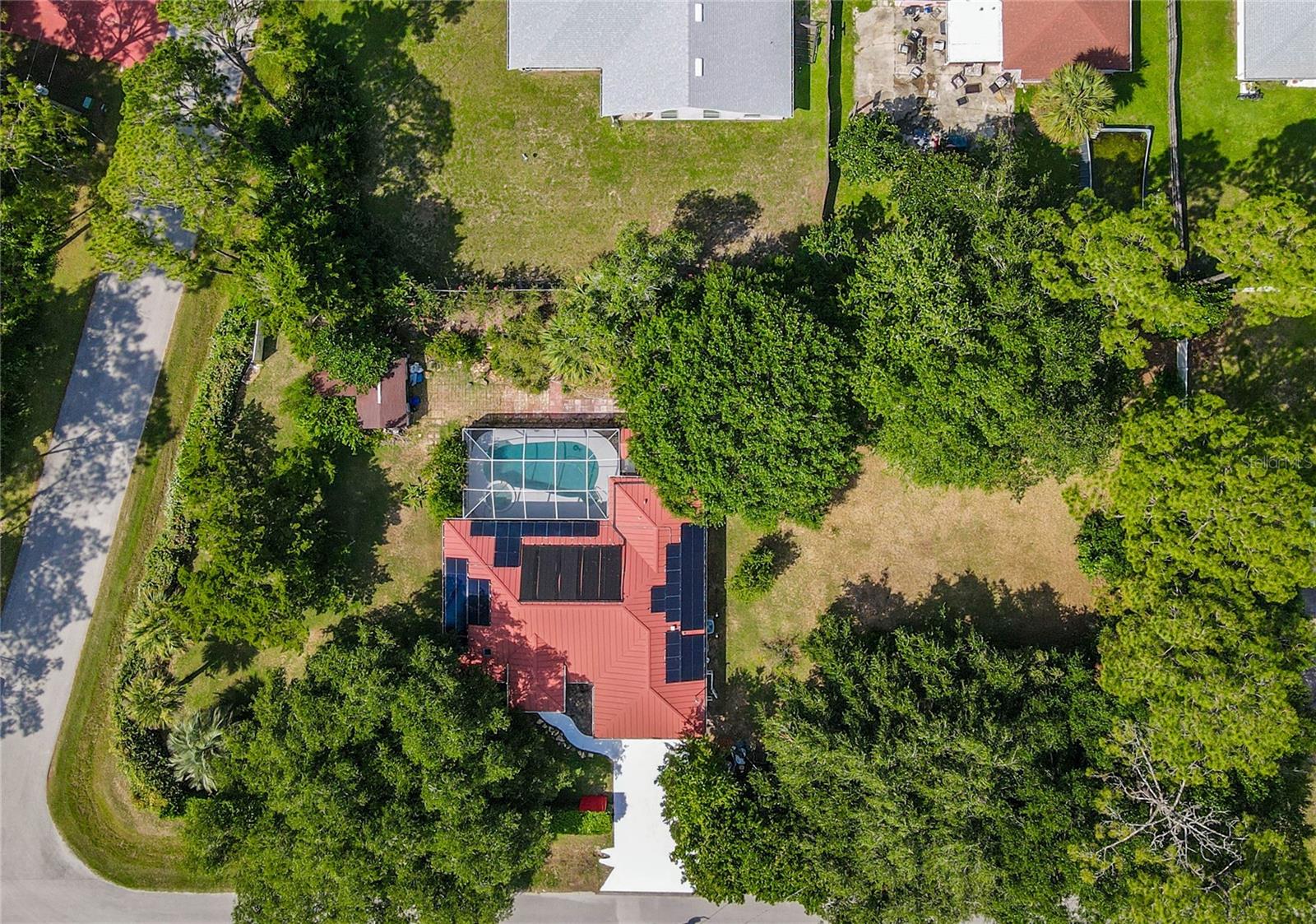 Have you ever thought that paradise could be this affordable? Your tropical dreams can now become your reality! This amazing POOL Home has everything for the perfect Modern Florida lifestyle. Home was built in 1994 on an overside corner lot with another lot combined total of two thirds of an acre. This home features three bedrooms, two bathrooms and two car garage. Enjoy Florida outdoor living with extended vinyl privacy fence in back part of the yard and naturally fully fenced all around for full privacy. Well maintained solar heated Pool with a built-in spa with a lot of room for seating, sunbathing, or entertainment. Enjoy and relax in Swedish Sauna after workout or hard-working day. Bathroom entrance from the pool to the second bathroom. The heart of the home features a kitchen with a breakfast nook, granite countertops, ideal for entertaining family and friends. Primary suite has a tray ceiling complete with an en-suite bath, large shower, and hers and his closet spaces lined with cedarwood. Jacuzzi Spa walk in tub in the second bath. It is a very efficient house with financed solar panels and a leased propane tank.
*** This house is set on one oversized corner lot, and another lot is combined to one parcel. Plenty of room for planting a small orchard. Buyers may be able to split back to two separate parcels and take advantage of duplex zone lot.
*** This house has a financed solar panel, and it will be paid off at closing.
*** Propane tank is leased. 
*** YOU MUST SEE! This house feels like you are in oasis, Schedule your showing today!