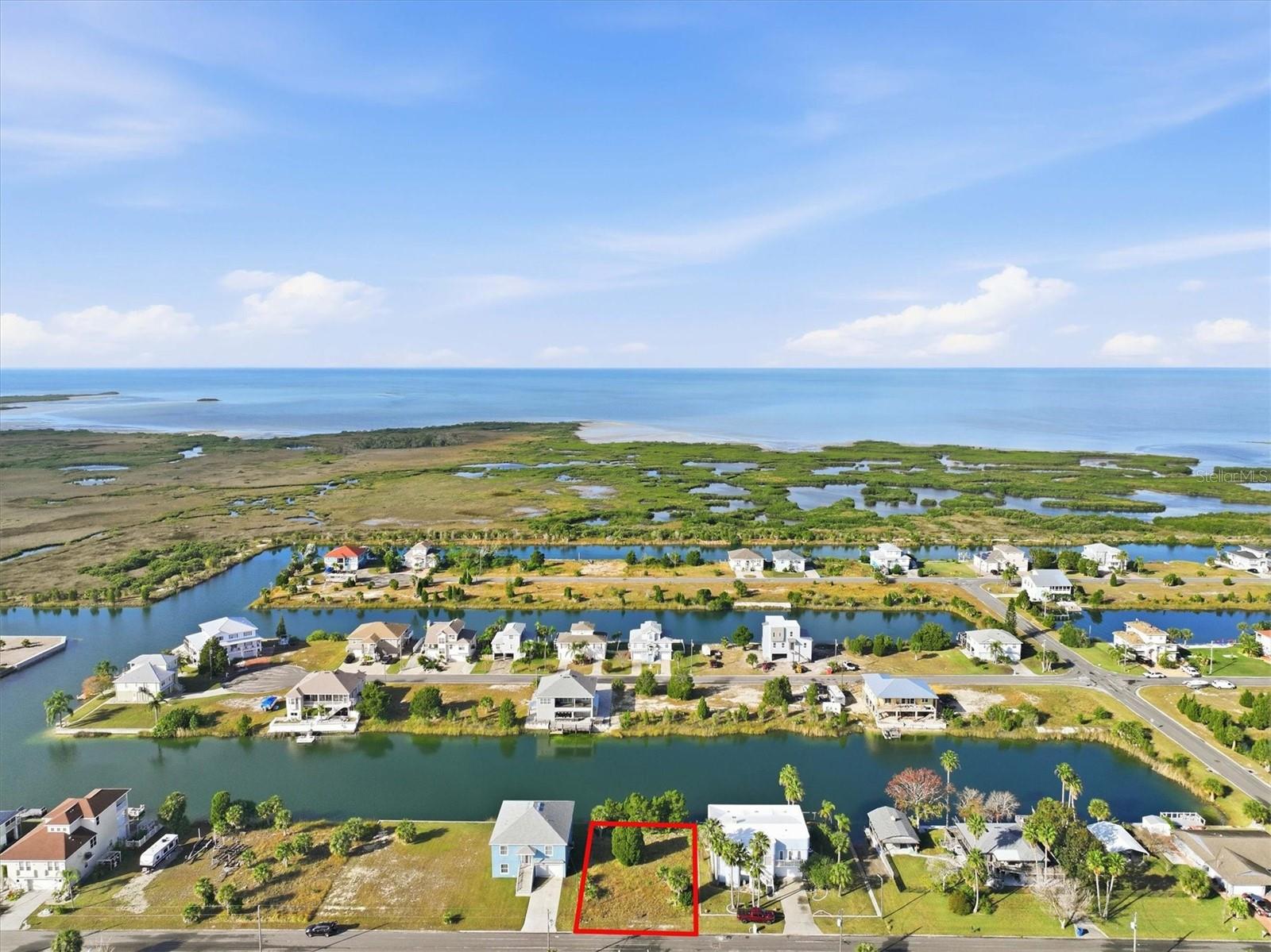 Waterfront Residential Building Lot in Hernando Beach!

This 71 x 100 residential lot in the indirect Gulf access section of Hernando Beach is the perfect setting for your Gulf Coast fishing home! This lot has 71 feet on a spring fed freshwater canal. 

Located in a no-HOA community, this lot offers flexibility and freedom—use your future home as a short-term rental for income potential or simply enjoy the perks of coastal living with no deed restrictions! Store your boat, trailer, or commercial vehicle on-site and build up to 8-foot privacy fences, following county codes instead of HOA rules.

Boating Info: Indirect Gulf Access – To reach the Gulf, boats must go over a seawall boat lift and then pass under a fixed bridge at street level. Freshwater canal system – Water levels fluctuate with seasonal rainfall, not the tides.

Discover Hernando Beach – A Hidden Gulf Coast Gem - Tucked away along the Gulf of Mexico, Hernando Beach is a tranquil coastal hamlet with a vibrant boating and fishing community. Here, you'll find waterfront tiki bars, marinas, seafood markets, and fine dining, all adding to the area's unique charm. Unlike its name suggests, Hernando Beach doesn’t have a traditional sandy shoreline, but it more than makes up for it with unparalleled water access and a laid-back coastal vibe.

For anglers, Hernando Beach is a world-class fishing destination with inshore fishing for redfish, snook, and tarpon, plus offshore opportunities for grouper and snapper. The Weeki Wachee River, just 5 minutes away, offers a refreshing escape with swimming, paddleboarding, and kayaking in crystal-clear 74-degree spring water.

Convenient Location - Despite its secluded feel, Hernando Beach is less than 10 minutes from US-19, offering easy access to shopping, dining, hospitals, and entertainment. Tampa International Airport is just an hour away, and Disney is only 90 minutes from your doorstep!

Build your dream home in Hernando Beach, where the Gulf Coast lifestyle meets the convenience of modern living. Call today to learn more!