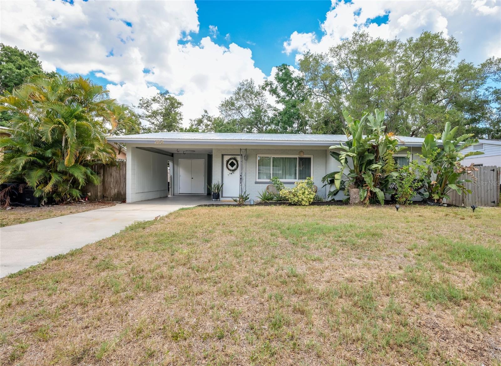 One or more photo(s) has been virtually staged. PRICE IMPROVEMENT!! Step into this move-in ready 2-bedroom, 2-bath home just minutes from world-famous Siesta Key and downtown Sarasota with no HOA restrictions! Enjoy the ultimate Florida lifestyle with top-rated schools and restaurants all within short distance, including Riverview High School and Phillippi Shores Elementary School.

The open-concept living area features beautiful hand-painted ceiling details, abundant natural light, and a warm atmosphere perfect for relaxing. Major upgrades include a 50-year metal roof (2019), upgraded windows, new hot water heater (2025), upgraded kitchen and primary bathroom, and fresh interior paint (2026). High and Dry no flood insurance required! 

Schedule your private showing today! Move-in ready. List agent is owner.