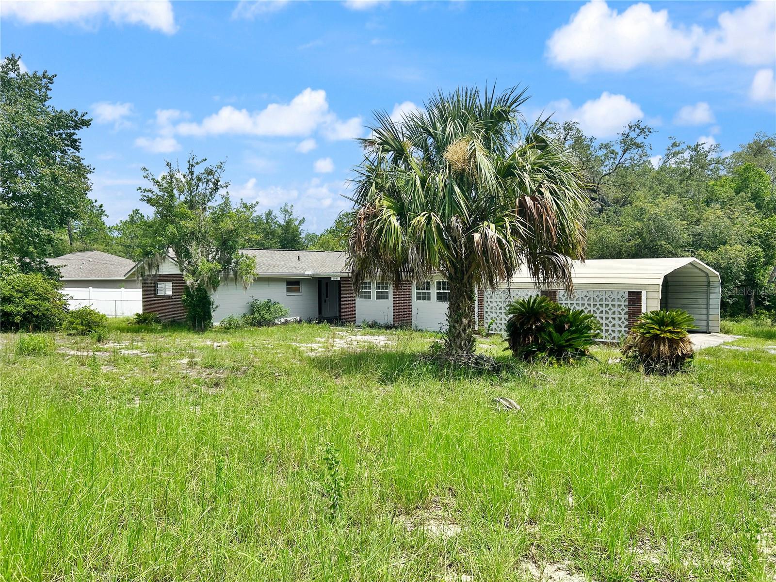 Rare opportunity to own a unique property on nearly 2 acres in Rainbow Lakes Estates! This spacious home offers approximately 1,831 square feet with a versatile layout featuring a 2-bedroom, 2-bath main living area plus a separate 3-bedroom, 1-bath wing/In-law suite—ideal for extended family, multi-generational living, guests, a home office setup, or other flexible living arrangements.

The property also includes a new central HVAC system, new roof, a clean four-point inspection is available, and the home sits on a buildable double lot, offering outstanding future potential for expansion, investment, or additional development (buyer to verify).

While the interior is ready for your personal updates, the combination of acreage, flexible floor plan, and future possibilities makes this property unlike anything else in the area. With nearly 2 acres of land, room for all your toys, and convenient access to Rainbow Springs, the Rainbow River, shopping, and outdoor recreation, this is an exceptional opportunity to create your own private retreat.

Properties offering this much space, flexibility, and future potential rarely become available at this price point. May qualify for No money down USDA fininacing!! Kitchen appliances to be installed befopre closing. Schedule your tour today!
