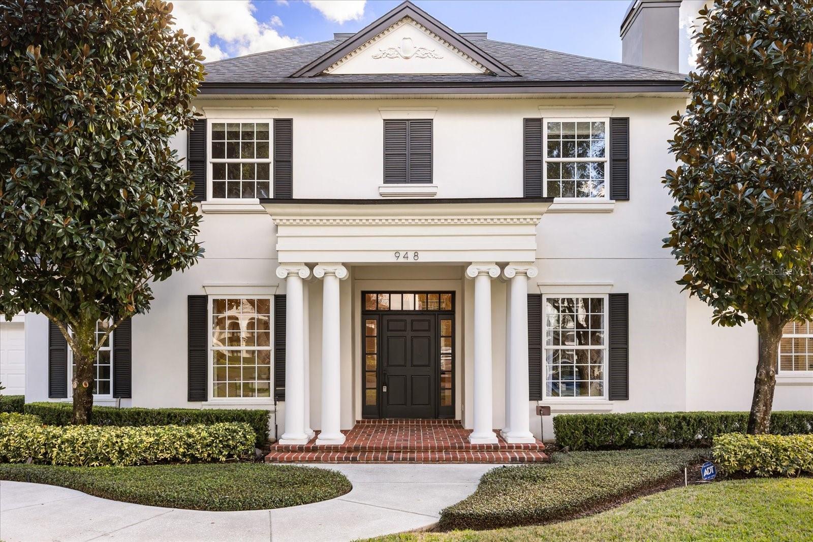 Timeless Elegance Meets Modern Luxury in Winter Park's Most Coveted Location
Discover an extraordinary residence where exceptional craftsmanship and sophisticated design converge at 948 Poinciana Lane. This meticulously reimagined estate represents the pinnacle of refined living in one of Winter Park's most prestigious neighborhoods, offering an effortless blend of classic architecture and contemporary luxury.
From the moment you step through the elegant foyer, you're greeted by sun-drenched interiors showcasing gleaming hardwood floors, soaring coffered ceilings, and designer details at every turn. The thoughtful floor plan reveals a private home office with custom built-ins and fireplace to the right, and a gracious formal dining room to the left—perfect for hosting memorable gatherings.
The heart of this home is the spectacular kitchen, a true chef's masterpiece featuring custom cabinetry, pristine marble countertops, statement pendant lighting, and top-tier appliances. This culinary haven flows seamlessly into the light-filled family room, where expansive windows frame views of your private outdoor sanctuary.
The first-floor primary retreat is a haven of tranquility, featuring an expansive walk-in dressing room with exceptional storage and a spa-inspired ensuite bath. Luxuriate in the freestanding soaking tub, refresh in the walk-in shower, or prepare for your day at the generous double vanity—all appointed with elegant finishes befitting this caliber of home.
Three generously proportioned guest bedrooms upstairs offer optimal comfort and privacy, complemented by a Jack-and-Jill bath and additional hall bath. A spacious bonus room with backyard views provides versatility for a media room, playroom, or home gym. Above the garage, an additional 260-square-foot bonus room with wet bar and wine fridge creates the ideal entertainer's lounge or game room.
Step through French doors to your private resort-style backyard—a meticulously landscaped oasis featuring a sparkling pool and spa surrounded by lush greenery, stately palms, and thoughtful lighting. Whether gathering around the firepit, lounging poolside, or dining alfresco under the stars, this outdoor retreat elevates everyday living to an art form.
No detail has been overlooked in this complete renovation: designer light fixtures and custom window treatments throughout, first-floor laundry convenience, elevated trim and baseboard, fresh paint, recessed lighting, and three HVAC units ensuring year-round comfort.
The location is simply unparalleled—a leisurely stroll to the Winter Park Racquet Club, zoned for A-rated public schools, and just moments from the world-renowned shops and restaurants of Park Avenue. This is more than a home; it's a lifestyle of distinction in Central Florida's most desirable address.