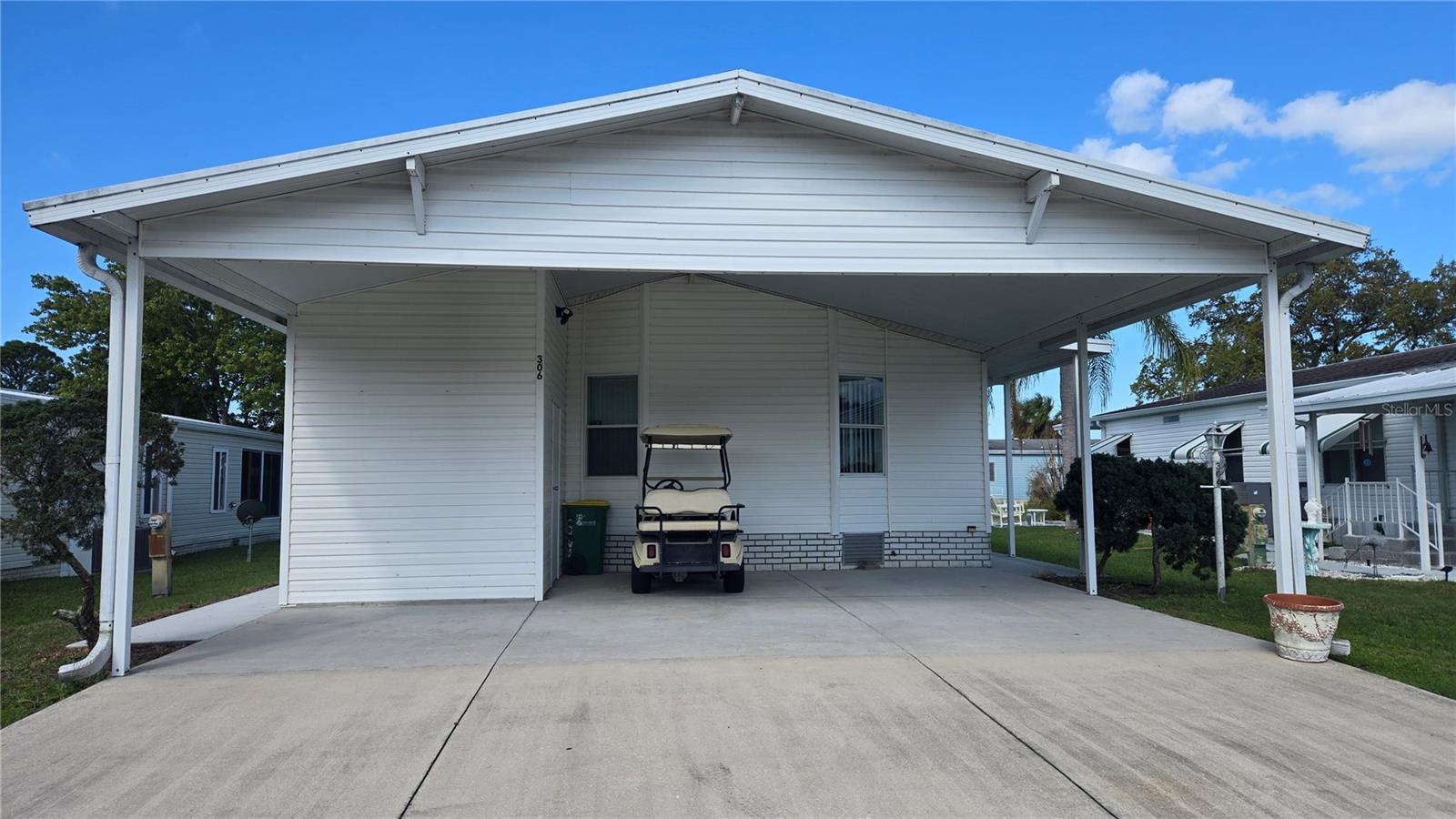 Well-maintained 2 bedroom, 2 bath home in an active gated 55+ lakefront community with clubhouse and pool. This inviting residence features an open floor plan, spacious open kitchen, and a relaxing screened porch perfect for enjoying Florida's beautiful weather. A 2-car carport, recent roof, and newer A/C add value and peace of mind. Ideal as a retirement retreat or second home for northern buyers seeking the Florida lifestyle of sun and water. Conveniently located near Orlando International Airport, Disney, and just a short drive to area beaches.