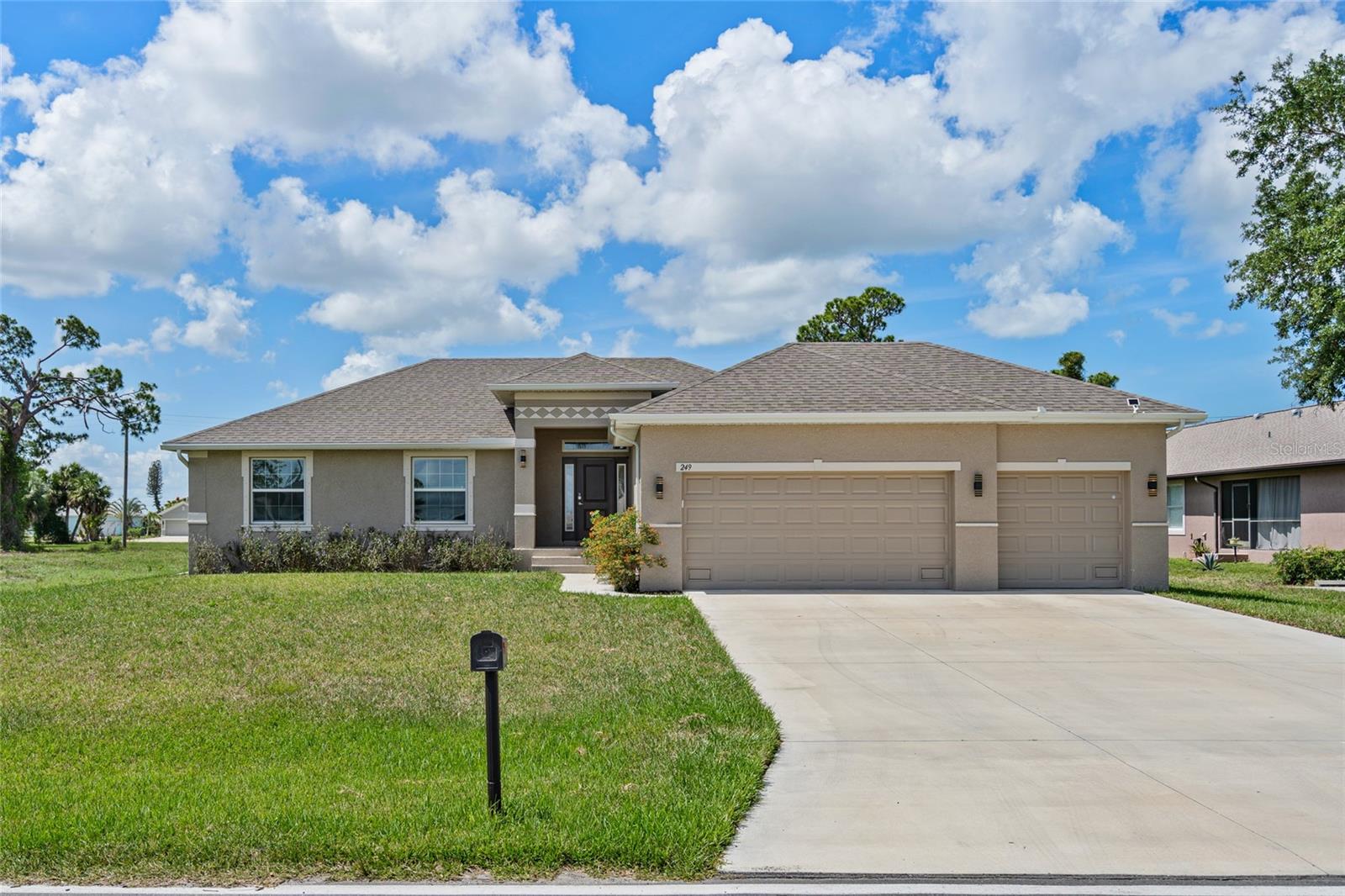 Welcome to 249 Rotonda Blvd W, a beautifully maintained 2021-built home located in the desirable Oakland Hills section of Rotonda West. This spacious 4-bedroom, 2-bath home offers 1,755 square feet of comfortable living space, a 3-car garage, and an oversized 0.37-acre lot.
Step inside to an open and inviting floor plan featuring cathedral ceilings, tray ceiling accents, stone countertops, upgraded cabinetry, and a kitchen/family room combination designed for everyday living and entertaining. The main living areas feature tile flooring, while the bedrooms offer a comfortable private retreat. The primary suite includes a walk-in closet and a well-appointed bathroom with a tiled shower and dual-sink layout.
Enjoy Florida living from the covered rear lanai overlooking the spacious backyard, with plenty of room to relax, garden, entertain, or explore future outdoor possibilities. Additional features include hurricane shutters, an irrigation system, public water and sewer, and low annual HOA fees.
Rotonda West offers a peaceful residential setting near golf courses, parks, boating, fishing, Gulf beaches, shopping, restaurants, and everything Southwest Florida living has to offer. Furniture is available to stay, making this home an attractive option for buyers looking for a move-in-ready opportunity.
Schedule your private showing today and see why this Rotonda West home is a strong value in today’s market.