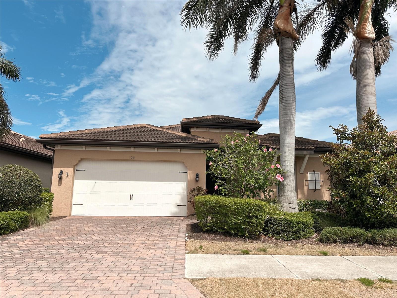 This beautiful single-family home features 3 bedrooms plus a den and 2 bathrooms, located in the highly desirable gated community of Toscana Isles. The flexible den space can easily be used as a home office, den, or even a fourth bedroom. The home showcases an open floor plan with a well-appointed kitchen featuring a center island, granite countertops, crown molding, a walk-in pantry, and an adjoining dining area. Sliding glass doors from the dining space lead to a screened-in lanai, perfect for indoor-outdoor living. The main living areas feature ceramic tile flooring, while the bedrooms are comfortably carpeted. The primary suite offers dual walk-in closets and an ensuite bathroom with double vanities and a walk-in shower. Additional highlights include a tile roof, brick paver driveway, and covered lanai. Toscana Isles is a maintenance-free community offering resort-style amenities designed for an active and social lifestyle. Residents enjoy a heated community pool, a lakefront clubhouse with a catering kitchen, billiards room with bar and TVs, modern fitness center, tennis, pickleball, and bocce courts, as well as a playground and large fire pit. The community also offers opportunities for fishing, kayaking, and canoeing on its scenic lakes. Ideally located, Toscana Isles is just a short drive from downtown Venice and Sarasota, with convenient access to restaurants, shopping, the Legacy Trail, I-75, Tamiami Trail (US-41), and the new Sarasota Memorial Hospital Venice Campus.