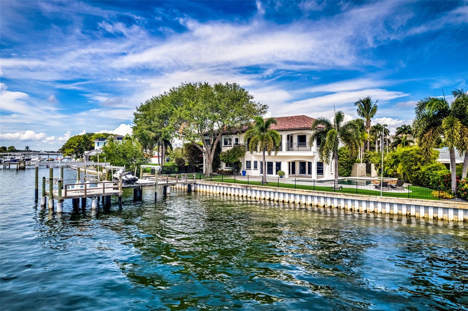 Expansive Waterfront Boater’s Paradise on Prestigious Bayshore Blvd

Welcome to your dream waterfront retreat on the iconic Bayshore Blvd, a canvas ready for your vision. This contemporary gem, with its exceptional 135 feet of prime waterfront, offers unparalleled views of protected waters, making it a true boater’s paradise. Though it has experienced minimal storm damage, the property has been meticulously cleaned and prepared, allowing you to reimagine and customize every aspect to suit your unique taste.

Imagine designing your ideal home with six spacious bedrooms and five and a half baths, accompanied by generous room for a five-car garage and an in-law suite. The possibilities are endless, whether you choose to remodel or rebuild. Envision an outdoor oasis featuring a heated pool, outdoor kitchen, and a private dock complete with a boat lift—perfect for setting sail into the tranquil waters of Tampa Bay at a moment’s notice.

As you approach, the welcoming front facade, adorned with lush tropical landscaping, beckons you inside. Grand double doors open into a luminous foyer, leading to expansive living areas flooded with natural light. The heart of this residence is a chef's kitchen, primed for transformation into a culinary masterpiece, boasting space for premium stainless steel appliances and a large island bar—ideal for entertaining.

The versatile layout provides ample opportunities for personalization, with generously sized bedrooms each offering walk-in closets and en-suite bathrooms. The owner’s suite features direct access to a sprawling outdoor balcony, presenting unobstructed vistas of the bay—perfect for morning meditation or sunset cocktails.

Step outside to envision your future backyard sanctuary, complete with a heated pool and a private dock, granting you direct access to protected waters free of bridges. This unique feature ensures smooth sailing for boating enthusiasts eager to explore the open waters.

Additionally, the property boasts a luxurious 5-car garage, catering to car aficionados, alongside a spacious in-law suite with a private entrance, making it ideal for multi-generational living.

This exceptional residence is more than just a home; it embodies a lifestyle steeped in luxury and the serene beauty of waterfront living. Don’t miss this extraordinary opportunity to claim your slice of paradise on Bayshore Blvd and turn your vision into reality!