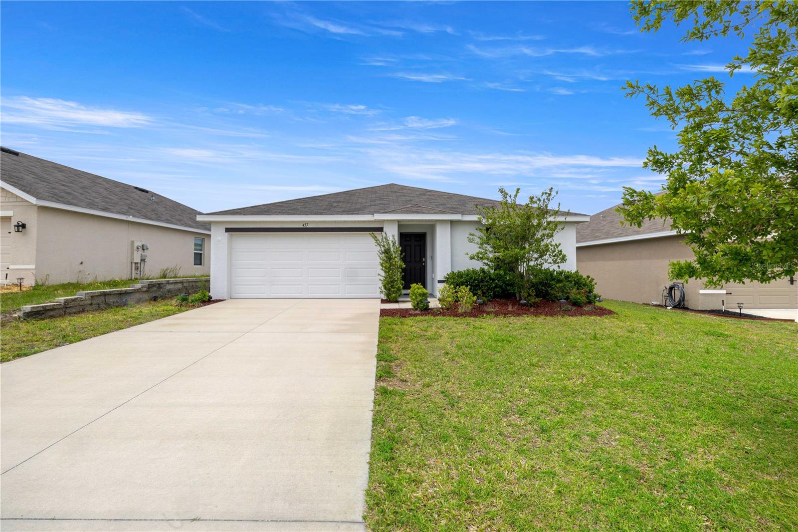 Located in a desirable golf community, this 4-bedroom, 2-bath, 2-car garage home offers a spacious and functional layout designed for comfortable Florida living. Situated on an oversized homesite with room for a future pool, the property also allows fencing and storage sheds, giving you the flexibility to create your ideal outdoor space. Inside, you’ll find an open and inviting floor plan featuring a formal dining room, a large living area, and a well-appointed kitchen with breakfast bar seating and stainless steel appliances — perfect for everyday living and entertaining alike. The split-bedroom design provides privacy, with three secondary bedrooms sharing a full bath complete with a generous linen closet. A dedicated laundry room adds convenience and additional storage. Privately located at the rear of the home, the spacious owner’s suite features high ceilings, a walk-in closet, and an en-suite bath with dual sinks, a walk-in tile shower, water closet, and an additional linen closet. Enjoy the freedom to design your own backyard retreat while being conveniently located near Beverly Hills Community Park, Central Ridge Library, shopping, dining, medical facilities, and the Suncoast Parkway for easy access to Tampa and surrounding Citrus County areas. Ideal for first-time buyers, seasonal residents, or investors seeking a well-located Florida home in a growing community.
