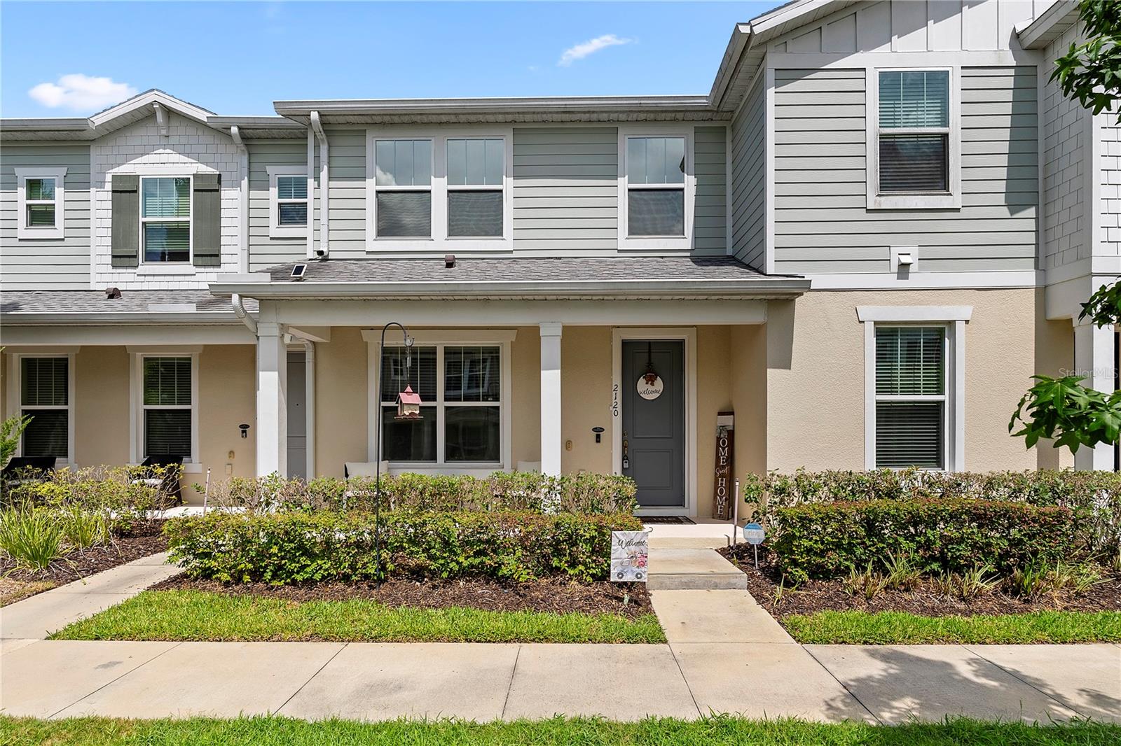 Located in the heart of Oakland, Florida, 2120 Gopher Tortoise Terrace offers the perfect blend of modern comfort, thoughtful upgrades, and an exceptional location surrounded by nature and convenience. This beautifully cared for 3 bedroom, 2.5 bathroom townhome also presents a rare opportunity for qualified buyers to potentially assume the seller’s attractive 2.75% mortgage rate, subject to lender approval, creating the possibility for substantial savings compared to current market rates. Inside, the home welcomes you with an airy open-concept design filled with natural light and stylish laminate flooring that carries throughout the main living spaces. The spacious layout connects the living, dining, and kitchen areas seamlessly, creating an ideal setup for both everyday living and entertaining guests. The kitchen has been designed with both function and style in mind, featuring granite countertops, stainless steel appliances, a large center island with seating, and a modern tile backsplash that adds a clean, upscale touch. Several custom improvements throughout the home elevate the overall experience, including upgraded pantry organization, custom shelving in the laundry room with a built-in drying pole, and professionally designed closet systems for enhanced storage and convenience. Upstairs, the primary suite serves as a relaxing private retreat, complete with a custom walk-in closet and an upgraded en-suite bathroom featuring raised countertops and a frameless glass shower. The additional bedrooms offer flexibility for family, visitors, or a dedicated home office space. Outside, the private paved courtyard creates a peaceful setting for morning coffee, outdoor dining, or relaxing evenings with friends and family. The surrounding location is one of the home’s standout features. Positioned directly across from the West Orange Trail, residents enjoy immediate access to miles of scenic walking, running, and biking paths. Just nearby, the Oakland Nature Preserve provides beautiful natural surroundings, wildlife, and additional trails to explore. The home is also conveniently close to Downtown Winter Garden, a highly sought-after destination known for its award-winning farmers market, local restaurants, boutique shopping, and year-round events that create a true sense of community. Combining a prime location, quality upgrades, and a welcoming layout, this home delivers an exceptional lifestyle opportunity in one of Central Florida’s most desirable areas.
