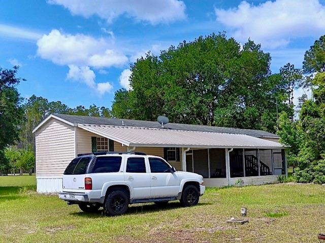 Peaceful two-bed, two-bath single-wide on three acres in Wiersdale. Split bedroom layout gives you privacy, tons of built-ins, all appliances included, partial furnishings, barn, carport, and screened Florida room. Perfect for comfortable country living! Escape to your own slice of Florida serenity! This charming single-wide sits on three peaceful acres in Wiersdale, complete with a cozy barn, covered carport, and a screened-in Florida room perfect for sipping sweet tea and watching sunsets. Your private country retreat awaits!”