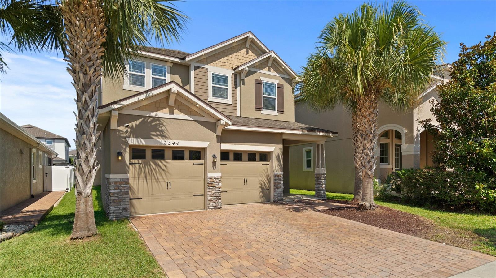 Nestled in the exclusive, 24-hour guard-gated Tapestry community, this stunning 3-bedroom, 2.5-bath home blends thoughtful design with effortless comfort — perfect for every stage of life. From the moment you step inside, the expansive, open-concept first floor welcomes you with beautiful tile throughout, offering endless possibilities for how you live, entertain, and unwind. A built-in bench near the entry keeps things organized and inviting, while a convenient half bath serves guests with ease. The generous kitchen is both stylish and smart, featuring energy-efficient appliances, freshly updated cabinetry, ample counter space, and a large pantry complete with a custom built-in storage nook — a dream for home chefs and busy households alike. Upstairs, a versatile open loft creates the ideal space for a home office, media room, or play area — adapting beautifully to your lifestyle. The private primary suite is a true retreat, showcasing an elegant tray ceiling, multiple closets, and a spa-inspired en-suite bath with dual sinks, a soaking tub, a separate shower, and a private water closet. Two additional oversized bedrooms — thoughtfully positioned on the opposite side of the home for maximum privacy — share a well-appointed bath with dual sinks and a shower/tub combination. Step outside to your own private oasis: a beautifully extended, screened-in covered patio overlooks a lush, oversized backyard — creating the perfect year-round space for morning coffee, evening entertaining, or simply soaking up the Florida lifestyle without the bugs. The spacious two-car garage with dual openers and generous storage rounds out this exceptional home. Beyond your front door, Tapestry's resort-style amenities elevate daily life — from the spectacular pool complex and fully equipped clubhouse fitness center, to a dedicated dog park and sweeping green spaces. Here, the vacation never ends.
This is more than a home — it's a lifestyle. Schedule your showing today!