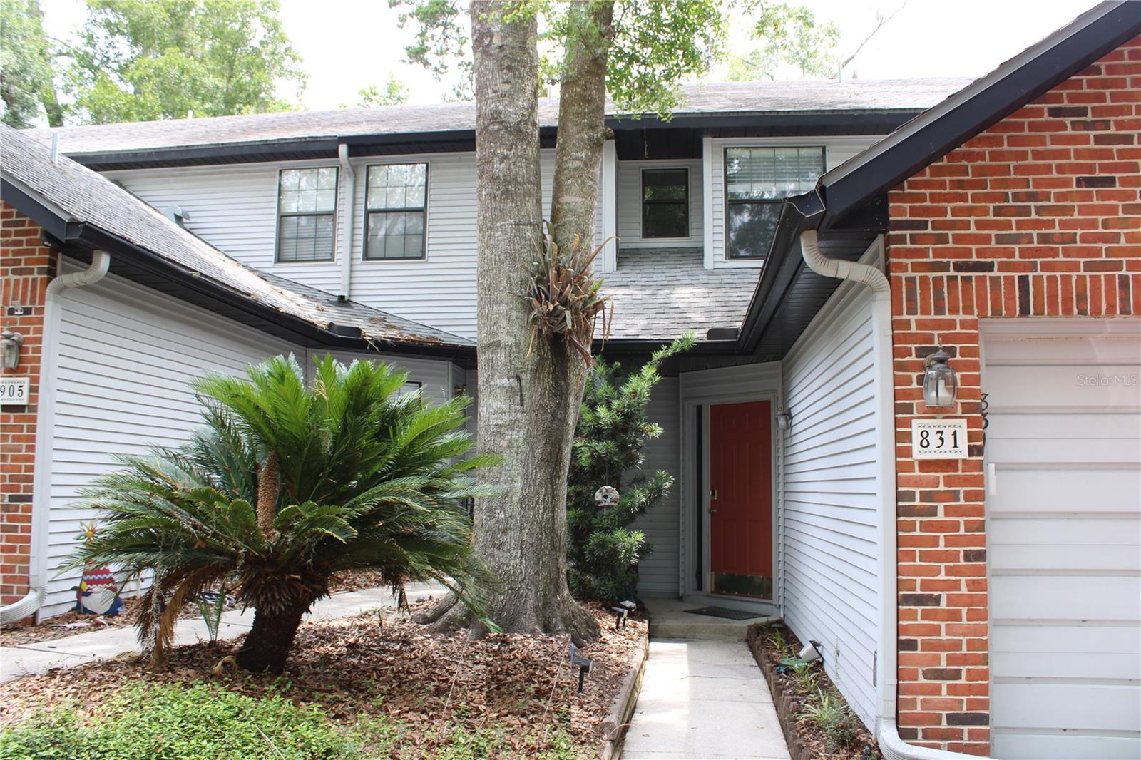 Central location, community pool, and conveniently close to shopping, UF, Shands, HCA, and I-75. Don’t miss out on this move-in ready town home in Lenox Place. This neat and clean 2-bedroom, 2.5-bath townhome features updated bathrooms and luxury vinyl plank flooring with ample living space and east-facing windows bringing in natural light. 

The first floor includes the kitchen, dining area, half bath and living room with French doors opening to a patio overlooking Hogtown Creek. Both spacious bedrooms are upstairs, each with its own full bath, including a primary suite with a walk-in closet. The attached one-car garage adds parking and storage, along with expansive, usable attic space. 

Water Heater replaced in 2020. HOA and Master Association combined dues of $409/month cover all exterior maintenance, roof upkeep, structural insurance, and community pool access — making this low-maintenance ownership for your busy lifestyle.