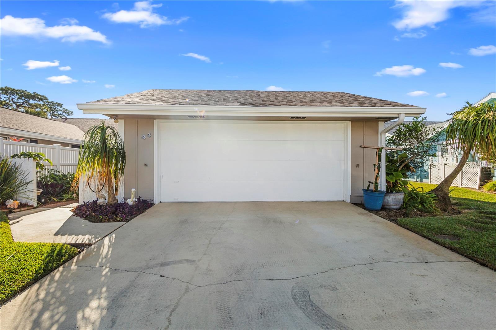 $295,000 for a pond-view duplex ten minutes from the beach, with three golf courses in reach — in New Smyrna Beach, that's not a typo, that's an opportunity. This 2-bedroom, 2-bathroom home in Hidden Lakes sits on a quiet street, with a back patio that looks out over open water instead of a neighbor's fence. Built in 1978, it offers 1,242 sq ft of heated/air living space (2,214 sq ft total). Hidden Lakes, NSB Municipal, and Turnbull Bay courses are all close by, and the beach is a straightforward 10-minute drive. Whether it's a primary residence, a seasonal base, or a low-maintenance investment, this one is about ease: quiet street, water view, golf nearby, beach down the road. Offered at $295,000.
