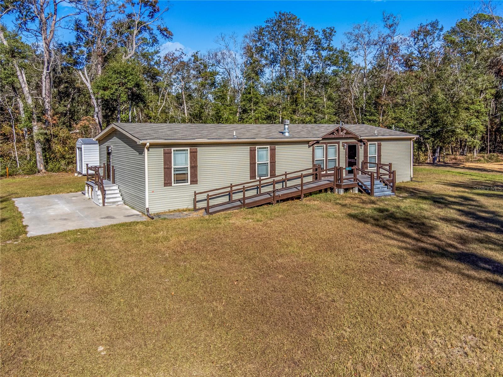 Welcome to this charming 3 bedroom, 2 bath home situated on 0.69 acres in the heart of Bell, Florida. This well-kept property offers a peaceful rural setting with plenty of space to relax and enjoy nature. The home features a screened-in back porch, perfect for morning coffee or unwinding after a long day, along with a storage shed that provides convenient space for tools, equipment, or outdoor gear. Located just minutes from the Suwannee River, this property is ideal for those who love boating, fishing, and riverfront adventures. A public boat ramp less than a quarter mile away makes it easy to get on the water anytime. The community is uniquely positioned between two expansive wildlife areas, offering abundant opportunities to explore nature, view local wildlife, and enjoy outdoor recreation. Bell is a small, welcoming town known for its relaxed lifestyle, top-rated local schools, and access to some of North Florida’s best natural attractions. Nearby you’ll find numerous freshwater springs, scenic parks, and endless opportunities for swimming, kayaking, hiking, and camping. Whether you're looking for a full-time residence or a peaceful getaway, this property offers a true taste of Florida’s natural beauty and charm.