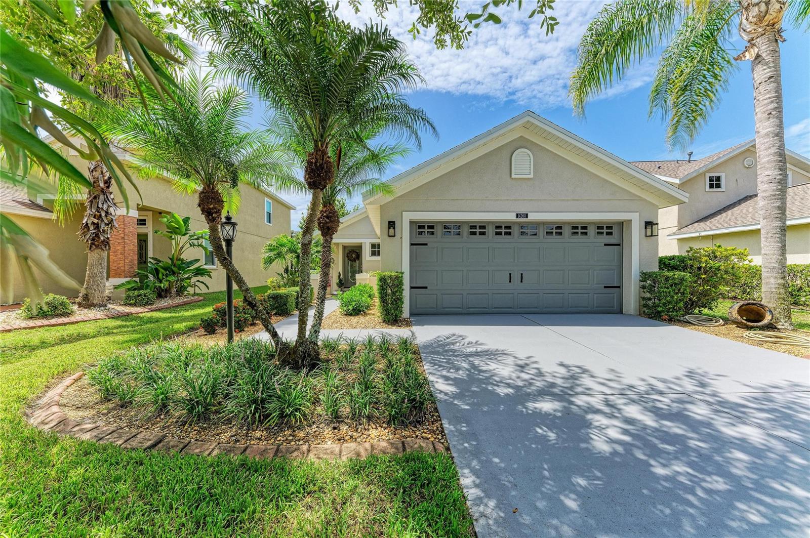 Move-in ready and meticulously maintained, this beautiful home is located in the highly desirable Greenbrook Village of Lakewood Ranch. Featuring an open great room floor plan with vaulted ceilings, this residence offers three bedrooms, two full bathrooms, and a premium lakefront lot with peaceful water views. The gourmet eat-in kitchen is designed for both everyday living and entertaining, showcasing granite countertops and a matching backsplash, a gas cooktop, stainless steel appliances, and light wood cabinetry. The spacious great room flows seamlessly to the enclosed rear lanai and outdoor sitting area, creating the perfect space to relax or entertain while enjoying the tranquil lake setting. Roof replaced in 2025, AC replaced in 2022.  Families will appreciate being within walking distance of A-rated schools, including McNeal Elementary and Nolan Middle School. With low HOA fees, this home offers an exceptional combination of comfort and value. Ideally situated in one of the nation’s premier master-planned communities, you’ll enjoy easy access to Greenbrook Adventure Park featuring nature trails, playgrounds, sports courts, a dog park and picnic areas. Conveniently located just minutes from I-75, University Town Center, Lakewood Ranch Main Street, Waterside Place, championship golf and tennis, exceptional dining, premier medical facilities, Sarasota-Bradenton International Airport, and the world-renowned Gulf Coast beaches. This is more than just a home - it’s a lifestyle. Welcome to Lakewood Ranch. Welcome to paradise.