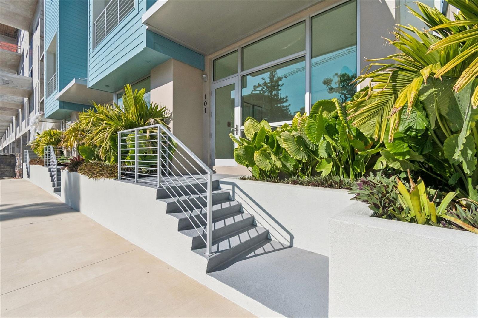 Live grounded. Create freely. Canvas RADD introduces a single-level, 3-bedroom, 3-bath live/work residence set at street level in Sarasota’s Rosemary Arts and Design District, designed for flexibility, presence, and creative flow in one of the city’s most dynamic neighborhoods. The layout unfolds across one generous level with high ceilings and expansive windows that bring in natural light and neighborhood energy, supporting a live/work configuration ideal for studios, offices, client-facing spaces, or simply room to spread out. A private landscaped yard and courtyard extend the home outdoors, offering a rare urban luxury for morning routines, informal meetings, pets, and evenings under the lights while remaining connected to the city. The architecture is sharp and purposeful, defined by clean lines, modern materials, and interiors that feel collected rather than conventional, complemented by the convenience of a private garage and effortless ground-floor access. Residents also enjoy access to curated shared amenities including a fitness studio for daily resets and a conference room for focused work, collaboration, or creative sessions without leaving the block. From the front door, Sarasota opens up quickly with walkable access to neighborhood favorites like Project Coffee, Shack Yoga, the Sarasota Farmers Market, and local dining and shopping throughout the Rosemary District, along with seamless access to the arts and culture of Downtown Sarasota including live performances, concerts, galleries, and theaters, plus easy drives to St. Armands Circle and nearby Gulf beaches.