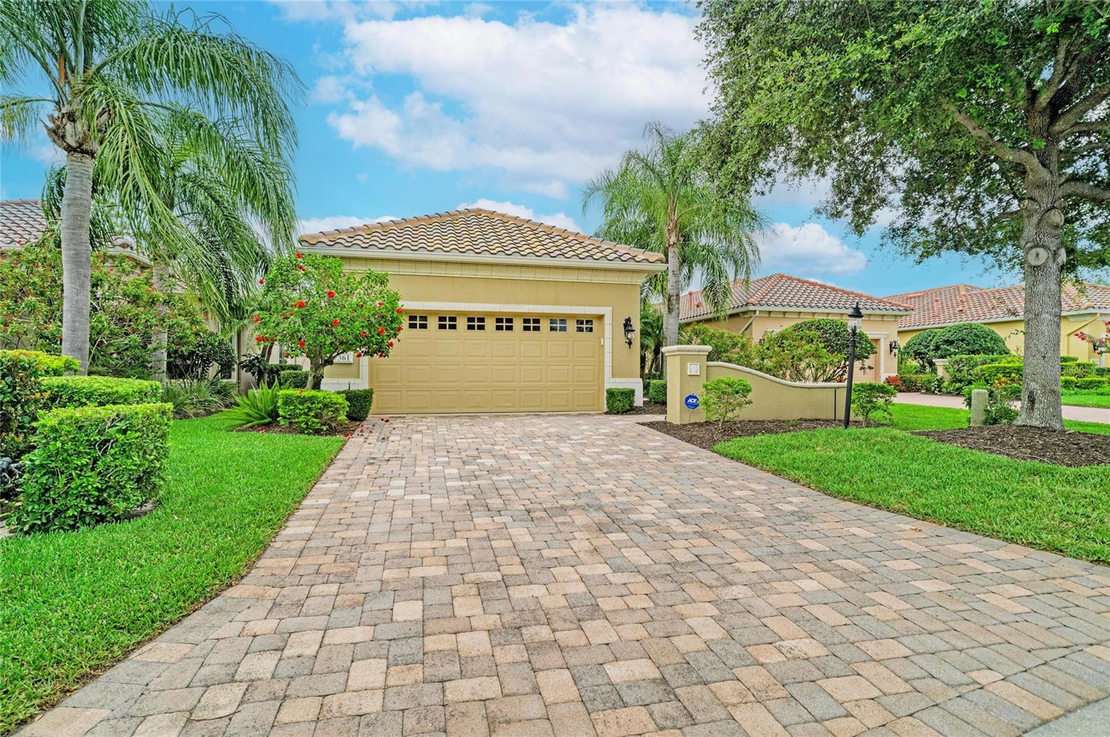 Virtually Staged. GREAT OPPORTUNITY IN LAKEWOOD RANCH GOLF & COUNTRY CLUB LIFESTYLE!!  Let's start with location, location, location.  This Neal Communities 2br/2ba plus study/den & formal dining room home is in the first village section inside the gates from Lakewood Ranch Blvd & Balmoral Woods Blvd.  This makes it easy to get in/out of LWR without being too far east of I75.  Striking architecture and quality craftsmanship create a magical allure throughout this 2215 sq.ft. prized home that sits on a lush mature preserve homesite.  Upon entering your eyes will be drawn to exquisite tile flooring with mosaic inlay and the striking quality crafted engineered wood flooring.  Soaring ceilings continue your journey throughout.  The large eat-in kitchen with island cabinetry/hidden trash containers, stainless steel appliances, glazed 2-tone cabinetry, granite surfaces and tile backsplash welcomes the family chef.  The family room is an inviting arena with triple-glass door slider access to the extended screened paver lanai and open floorplan from the kitchen.  Its opportune location allows you to be part of the conversation while entertaining.  Spacious while still being intimate, the master bedroom offers a tray ceiling and bay window, giving even more depth to the room. The master bath showcases a private water closet, 2 walk-in closets, an expansive seamless glass shower, deep fill tub and almond glazed cabinetry—duplicate to the kitchen.  The guest bedroom is oversized and can function as a En-Suite with a pocket door to the main living space.  Upgraded carpeting (replaced less than 2 years) adds warm finishing touches to both bedrooms.  The 2 car garage is extended for your convenience to easily accommodate a golf cart in addition to 2 vehicles.  New owners will save on utilities with a natural gas range & water heater and newer HVAC (2 yrs).  Storm protection includes galvanized hanging panels for all windows and doors.  Newly maintained items include painted interior walls throughout, power washed exterior & tile roof, and professional cleaning to make this home move-in ready!  The gated community offers maintenance included landscaping, lawn care and community pool within short walking distance.  Luxury resort golf, sports, & social MEMBERSHIPS ARE OPTIONAL which include access to 4 private golf courses, restaurants, social events, clubhouse facilities equipped with state-of-the-art fitness center, exercise classes, pickleball & tennis courts, and much more!  Conveniently close to Lakewood Ranch Blvd gate access to downtown Lakewood Ranch, Waterside, UTC mall shopping, medical facilities & Sarasota/Bradenton airport. Taxes include annual CDD fee. Schedule your showing today!