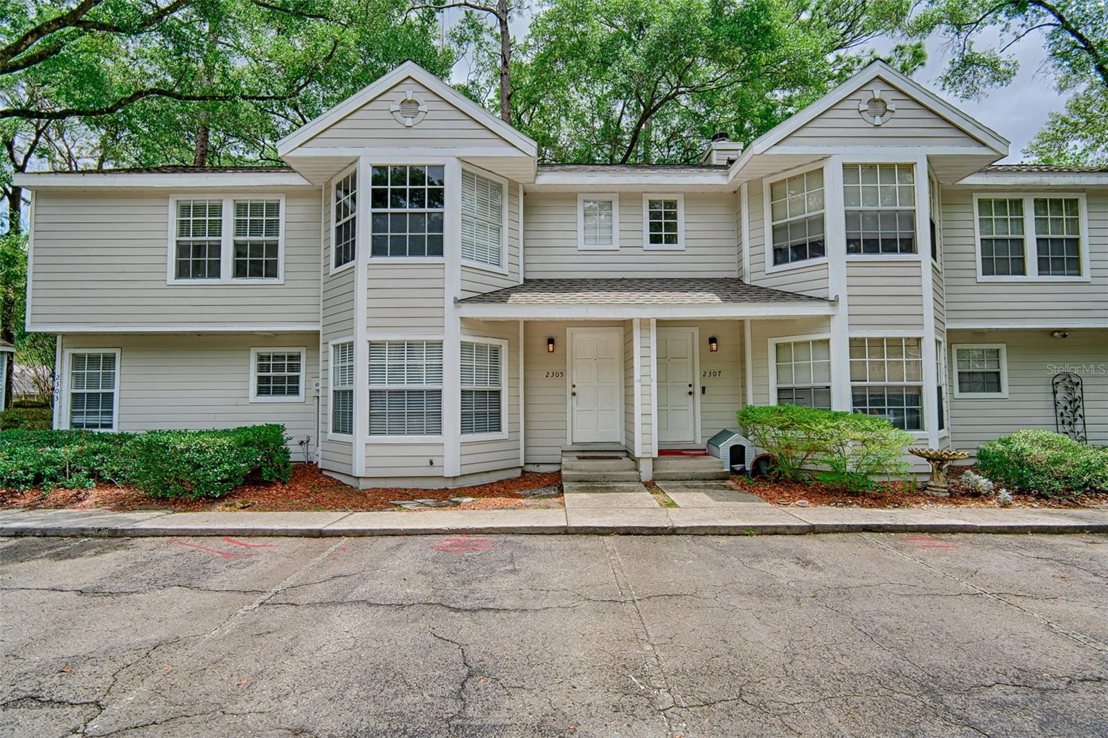 Welcome to a comfy 2 bedroom 1 1/2 bathroom townhouse condo located in the rear of a quiet neighborhood. Located a hop skip and jump from I-75, Newberry Rd and 34th Ave you can get anywhere within minutes. Tucked away you will enjoy a quiet night without loud noises. Recent upgrades include a new AC system less than a year and a half old. A new walk in shower big enough for two, roughly two years old. French doors lead you into a small back yard that has potential for small gatherings. In the living room to you have a wood burning fireplace for snuggling with loved ones or just relaxing watching the flames. The half bathroom is just off the kitchen and convenient while on the main floor out outside. The living room has bay windows allowing plenty of daylight when you want it. Second floor you will find the master bedroom located on the rear side with a decent sized walk in closet. You also have a spare sink with a large mirror and plenty of cabinet space. The second room has bay windows also with a small closet perfect for a child. Connecting the bedrooms is a jack and jill bathroom with plenty of counter space and the walk in shower. The owners were in the process of remodeling and updating top floor but had to stop due to needing to move north to help with family. If you don't mind putting in a little work you can turn this into your own gem of a home. With a little TLC you can make this what you want.