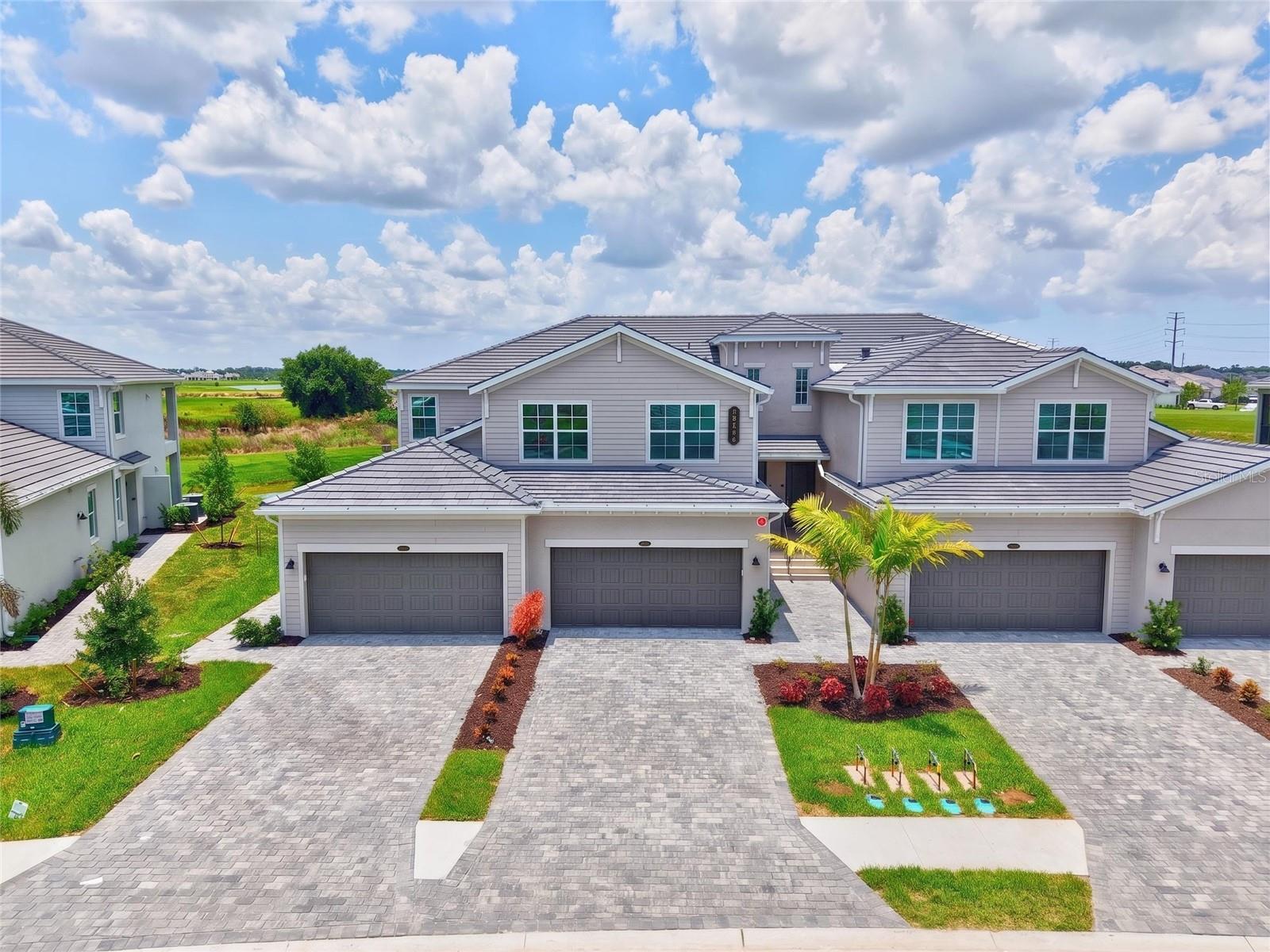 Some homes simply offer a place to live. This brand new, never occupied, 3/2/2,110sqft Coach Home with available golf membership offers a way of living. Including an attached two-car garage, screened lanai with water and golf course view, and natural gas.

Welcome to Calusa Country Club, each morning begins with sunlight dancing across the water, golfers quietly making their way down emerald fairways, and the promise that life can move at a gentler pace.

This brand-new second-floor Coach home is filled with natural light, creating a bright, open atmosphere that feels both peaceful and inviting from the moment you step inside. Modern design elevates every space, from the solid marble countertops to the natural gas range, gas dryer, and on-demand natural gas water heater details chosen for both beauty and everyday comfort.

The spacious great room flows effortlessly onto a screened lanai where tranquil water and golf course views become part of your daily routine. Whether it's a quiet sunrise with coffee or an evening glass of wine beneath painted Florida skies, the view never grows old.

Storage is abundant, with generous walk-in closets in every bedroom including two oversized walk-in closets in the primary suite. The primary bath offers a large walk-in shower that feels more like a private spa than a traditional bathroom, while the Coach home's light-filled layout creates an easy sense of openness throughout.

Outside your front door, a maintenance-free lifestyle allows you to spend less time on chores and more time enjoying everything this remarkable community is becoming.

For golf enthusiasts, an optional golf membership may be transferred to the tenant for a one-time transfer fee of just $200, providing access to two completed championship courses an 18-hole course and a 12-hole course along with the community's professional golf shop.

Calusa Country Club continues to grow into one of Southwest Florida's premier lifestyle destinations. The Burger Bar is already welcoming residents, while pickleball and tennis courts are anticipated to open in October. The resort-style pool, Tiki Bar, and wellness center are expected to debut in early 2027, followed by the clubhouse restaurant and state-of-the-art golf simulator in the fall of 2027, creating a community designed for gathering, recreation, and everyday enjoyment.

Perfectly situated, you'll enjoy convenient access to Lakewood Ranch, Waterside Place, downtown Sarasota, University Town Center, award-winning Gulf beaches, shopping, dining, medical facilities, Sarasota-Bradenton International Airport, and Interstate 75 placing everything you need within easy reach while allowing home to remain a peaceful retreat.

This isn't simply a new home.

It's the beginning of slower mornings, longer sunsets, neighbors who become friends, and weekends that feel like vacation. It's a home where comfort meets elegance, where every window frames a beautiful view, and where each day offers another opportunity to enjoy one of Florida's newest country club communities.

Available now. Come experience what it feels like when home becomes the best part of every day.

Tenant pays utilities. Liability insurance required.