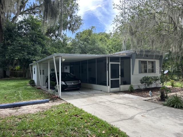 Very well maintained manufactured home in Summerfileld!! 3 bedrooms and 1 bath, the eat bar in kitchen opens to the living room with closet pantry, 27x11 family room has door to front and backyards and bath with tub/shower. 36x7 screen porch, 36x11 carport, 10x8 utility area with washer/dryer hookups and 9x9 storage shed. Property is completely fenced with entry gate. Located close to The Villages for dining, shopping and entertainment.