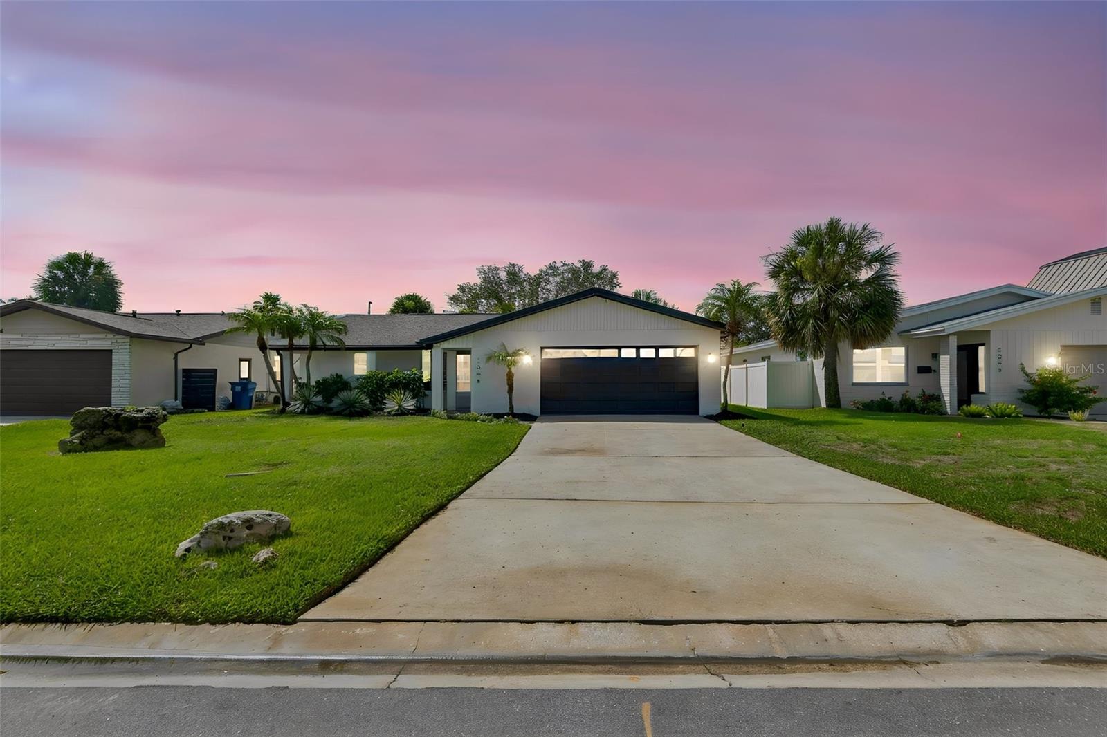 Welcome home to this beautiful 3 Bedroom 2 Bath 2 Car Garage POOL HOME in beautiful St Petersburg! HUGE YARD and an amazing RESORT STYLE OUTDOOR POOLSIDE KITCHEN AND ENTERTAINING AREA!!! If you are looking for the perfect starter or family home, look no further. This home has been TOTALLY RENOVATED by the owner and includes upgrades perfectly fit for a first time home buyer or growing family. The totally remodeled kitchen features solid wood cabinets, granite countertops, stainless steel appliances, custom backsplash, and a designer faucet. The entire home is tiled with beautiful wood look tile. The bathrooms feature the same level of upgrades including custom vanities, granite countertops, designer tile, and new hardware. Other upgrades NEW AC (2020), NEW TANKLESS WATER HEATER (2024), ROOF (2019), new plumbing, new flooring throughout, new interior and exterior paint, new custom blinds new designer light fixtures, and MORE!! All of these amenities and upgrades are complimented by the unique curb appeal of the home which sits on a quiet street! This home has many desirable features and is a must see. Please call us or use ShowingTime to set up a showing today!