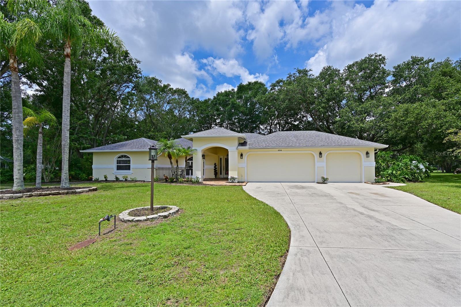 $20,000 PRICE REDUCTION - now reduced $40,000.....this is your home! Hidden Oaks - a small gem of a neighborhood with over sized lots and unique homes!  This is a sweet three bedroom, two bath home - great room plan with separate dining area and nice sized kitchen including plenty of storage and raised bar area.  There is a sparkling pool with lanai area,  all overlooking peaceful woods. With split bedrooms, everyone has privacy and the master bedroom is spacious with an oversized walk in closet.  The shared bath on the opposite side of the home also is used as the pool bath, so no wet floors. The three car garage is a rariety and so helpful - a perfect Florida "basement".  Engineered wood or tile throughout the home for easy maintenance. The home sits on a quiet, wooded lot that is just over 1/2 acre.  Nearby amenities (grocery, restaurants, shops, etc) and easy access to I75.  Home warranty included.  NEW ROOF 2023. Seller says ‘bring all offers’!