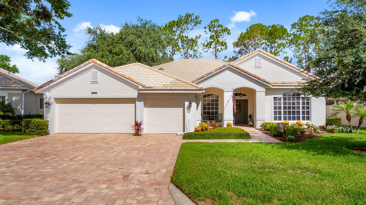 Ideally located in a popular guard gated 55+ community, with over 2700 sq. ft. of contemporary style golf living on the 13th fairway, and a 3 Car Garage sits 3916 Payton CT.  This home combines the finest finishes with multiple upgrades. With this exquisite 3 Bedroom 2.5 Bath with Office/Bonus Room/Den can adapt to any lifestyle. With Laminate, Tile, and Carpeting and large windows, this home offers an open, airy floor plan with lots of natural light for your enjoyment and that is perfect for entertaining family and friends. As you walk through the front door you will be greeted with a spacious living room and formal dining room graced with high ceilings and painted in neutral colors.  As you move on the modernized updated spacious kitchen you will find an abundance of wood cabinets equipped with pullout drawers and granite counter tops.  The kitchen is also updated with stainless steel appliances, double door refrigerator, dishwasher, & microwave.  The office/den/study has also been updated with built-in book shelves, desk, and file drawers. The heart of the home is the open, bright, and spacious family room, kitchen, and screened paver lanai that overlooks the golf course.  The Lanai is perfect for great conversations while entertaining or enjoying dinner with family and friends or enjoying the Florida sunsets. The bright spacious primary bedroom with soft lighting creates a soft ambiance and has views of the Golf Course. Escape to a relaxing retreat within the ensuite with his and her sinks, garden tub and separate tiled walk in shower.  This ensuite has an abundance of cabinet space. The spacious primary bedroom is graced with 2 large walk in closets.  The generously proportioned guest room has a window that overlooks the golf course.  The 2nd bedroom has built in’s and for extra company hosts a murphy bed and walk in closet! The 2nd Bathroom boasts 2 double sinks and a tub with shower and is strategically placed between the 2nd and 3rd bedroom. This updated golf course home boasts newer double pane windows, except for formal living and dining room front windows, AC 2024, hot water heater 2022, pavers have recently been resealed.   If you love entertaining outdoors or indoors this home has one of the most beautiful views of the golf course.  Kings Ridge enhances easy shopping by driving your golf cart to Publix, Restaurants, Salons, Pet Supply and Groomer, Liquor Store, Banking, Gas Station, Pizza, and Ice Cream! Discover the epitome of comfortable active lifestyle living in Kings Ridge. Kings Ridge boasts 2 Golf Courses, 3 Pools, Hot/Cold Tubs, Dry Saunas, Steam Rooms, 2 Gyms, Tennis Courts, Pickleball Courts, Bocca Ball & Shuffleboard, and Basketball Courts. The Multi-Million Dollar Club House, is the heart of activities with Entertainment, Dances, Social Events, Games, Travel Clubs, etc. The monthly maintenance fees include lawn care, home phone, maintenance and trimming of shrubs, irrigation and replacement of sprinkler heads, basic cable TV and internet, and road maintenance, and exterior painting every seven years. WELCOME TO A WELCOMING HAVEN CALLED HOME!
