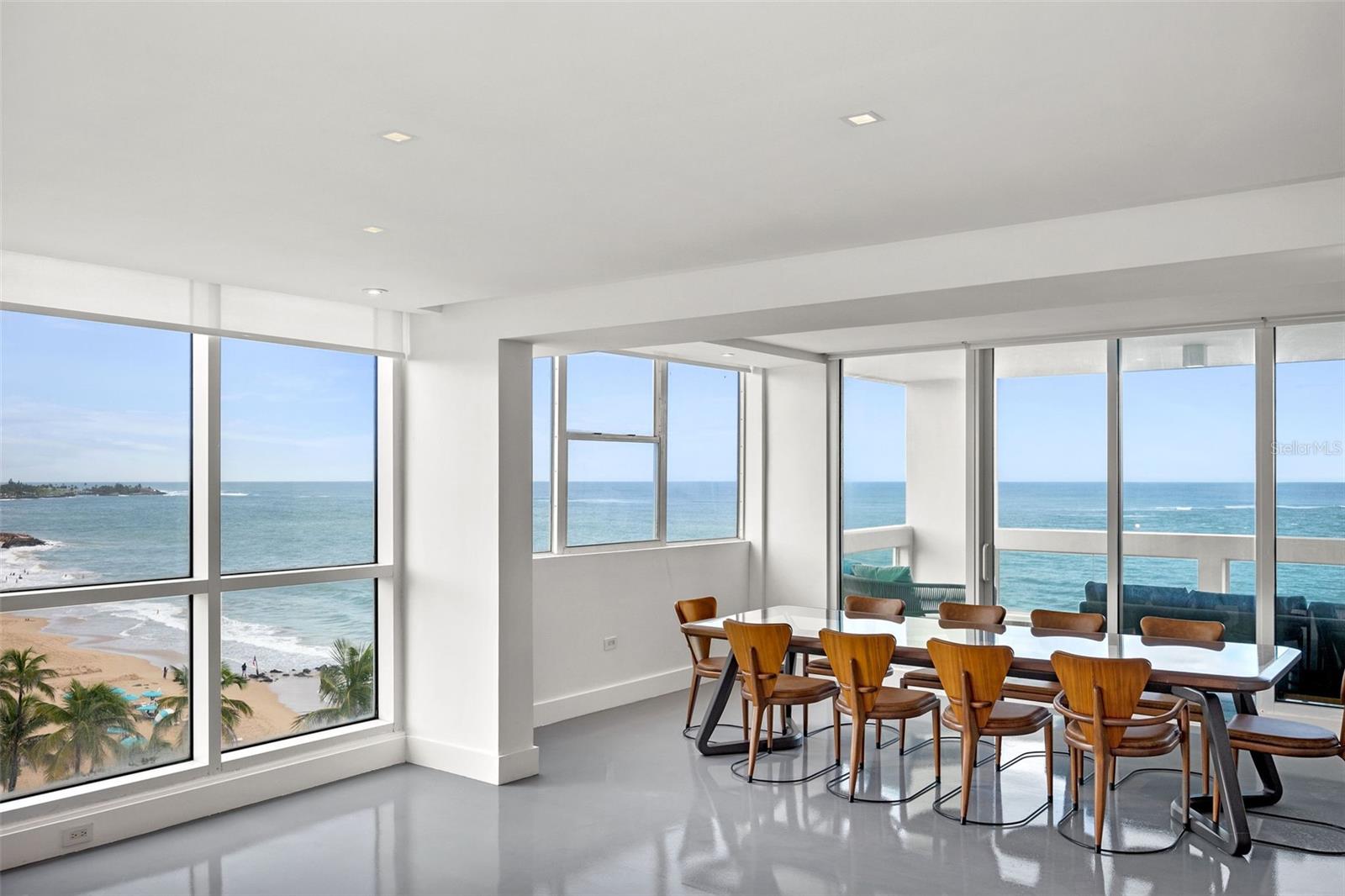 This spectacular brand-new remodel in Acquamarina - the newest and most modern beachfront condominium in all of Condado - is truly one of its kind.  Nine foot ceilings, a seamless and stunning epoxy floor, dry sauna in-unit, and a wide open floor plan with an imported Italian kitchen with satin granite stone countertops make this a truly breathtaking residence... and then you get to the view.  180 degrees of beach coastline and pure blue bliss await you as you spread out on your extra-large terrace and enjoy the reason(s) you came to Puerto Rico in the first place:  peace, tranquility, and a slice of heaven.  

Delivered fully furnished with brand new (unused) EVERYTHING, this is truly a brand new reconstruction.  The building is full service with 24 hour guard, full backup generator and cistern, beachfront access, a gorgeous pool and a modern gym.  Without question one of San Juan's premier addresses.

Everyone desires to live on the beach, feet in the sand, and this is your chance.  Hurry and call now!