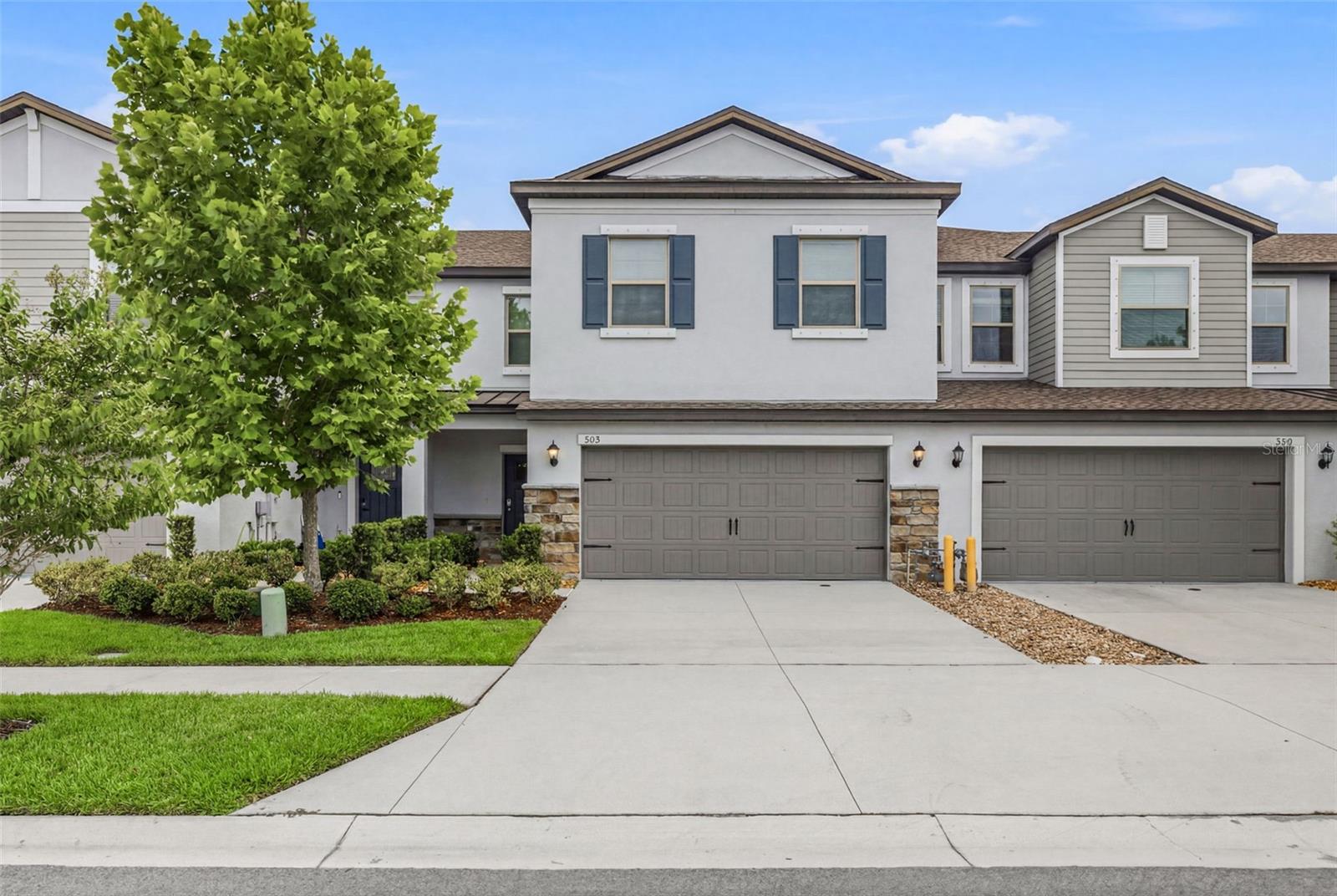 Short Sale. Welcome home to this stunning 2023-built townhome, where modern design, spacious living, and thoughtful upgrades come together to create an exceptional place to call home. Designed with both comfort and functionality in mind, the open-concept first floor creates the perfect gathering space, seamlessly connecting the kitchen, dining area, family room, and screened lanai. Whether you’re hosting friends or enjoying a quiet evening at home, this layout was made for everyday living. The stylish kitchen features gray cabinetry, granite countertops, and GE stainless steel appliances, while thoughtful upgrades such as a water softener, tankless hot water heater and EV charging station add convenience and value. Upstairs, you’ll find a spacious loft that offers endless possibilities as a media room, home office, playroom, or second living area. The private owner’s retreat serves as a true sanctuary, complete with two walk-in closets and a beautifully appointed en-suite bath featuring dual vanities and modern finishes. Three additional bedrooms provide plenty of space for family and guests, and all bedrooms include ceiling fans for year-round comfort. Located directly across from guest parking, this home also enjoys access to Bryant Square’s exceptional amenities, including two community pools, walking trails, and picturesque surroundings. Conveniently situated just one traffic light from SR 54 and Little Road, you’ll appreciate easy access to shopping, dining, medical facilities, fitness centers, top-rated schools, and area hospitals. Modern construction, desirable upgrades, spacious living areas, and an unbeatable location—this home truly offers the best of Florida living.