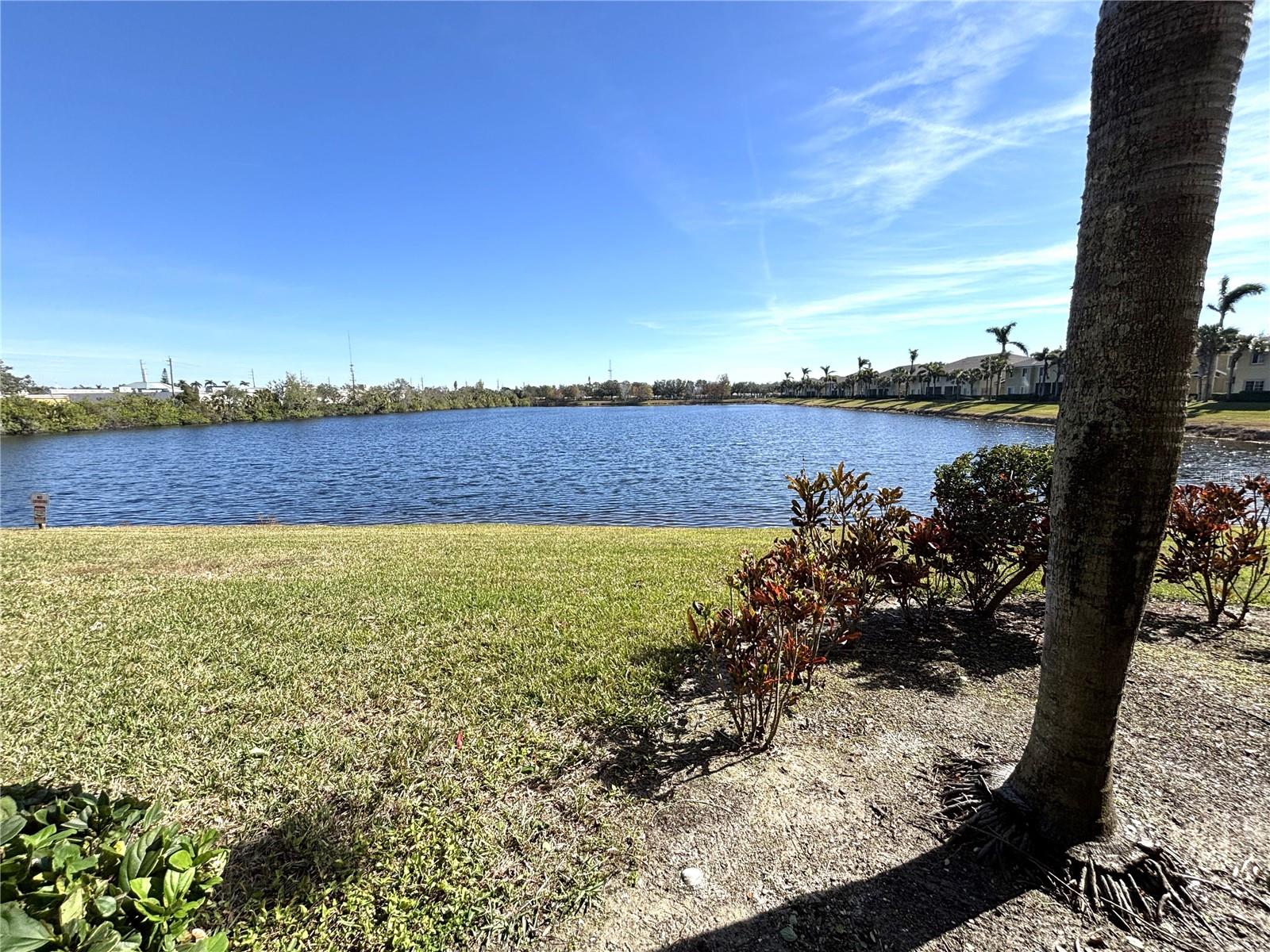 Turnkey-Furnished Tropical Townhome, Move-In Ready! Maintenance-Free, set on a private, gated street with the best lake views in the community!! Welcome Home! Upon entering you're immediately drawn in to rich colors and beautiful decor throughout. Tile and wood floors on first level. Kitchen has a pass through to separate dining room. Ground floor also includes a half bath and under stairs storage, plus storage on screened lanai. Upstairs features two Master Suites! Two full tiled baths, and a generous bonus/loft area perfect for use as a home office/study/den. Separate laundry room with stack-able washer/dryer in 2nd bathroom. Relax in the community's heated pool overlooking the lake and fishing pier. Minutes to the community of Anna Maria Island's beautiful beaches, and a short distance from IMG! Shopping and Restaurants are just a block away! This townhome is located very close to back access gate for convenience, and also there is ample parking in this area of Lakeside Village. Condo Assoc requires a 660+ credit score to buy or rent in this community.