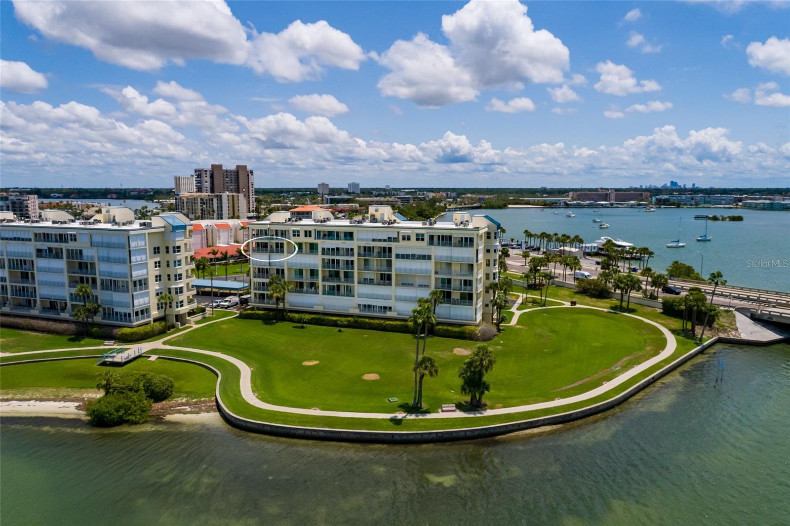 Come see this beautifully updated end unit condo in the highly desired HarbourSide waterfront community! This spacious 2-bedroom, 2-bath home with a den has been completely remodeled, including a reimagined kitchen that truly sets this condo apart. Enjoy elegant crown molding, wood floors, a wet bar, water softener, storm shutters, and an expanded den perfect for extra living or office space. This end unit has two spacious balconies, you have the front one for the sunrises and enjoy the sunsets from the back one. This unit also comes with an assigned under-building parking spot #146. HarbourSide offers resort-style living just minutes from St. Pete Beach. This gated community features 6 pools, a marina with 87 deeded slips (slips available for purchase or lease) not one with this unit, tennis/pickleball courts, shuffleboard, his & hers fitness centers with saunas, clubhouse with heated pool/spa, library, craft room, billiards room, outdoor grilling areas, car wash station, and a lively social calendar. Enjoy peaceful walks along the 1.5-mile waterfront path that surrounds the island. You would be hard presses to find a community with more amenities for your enjoyment. Live the Florida dream in this exceptional home!