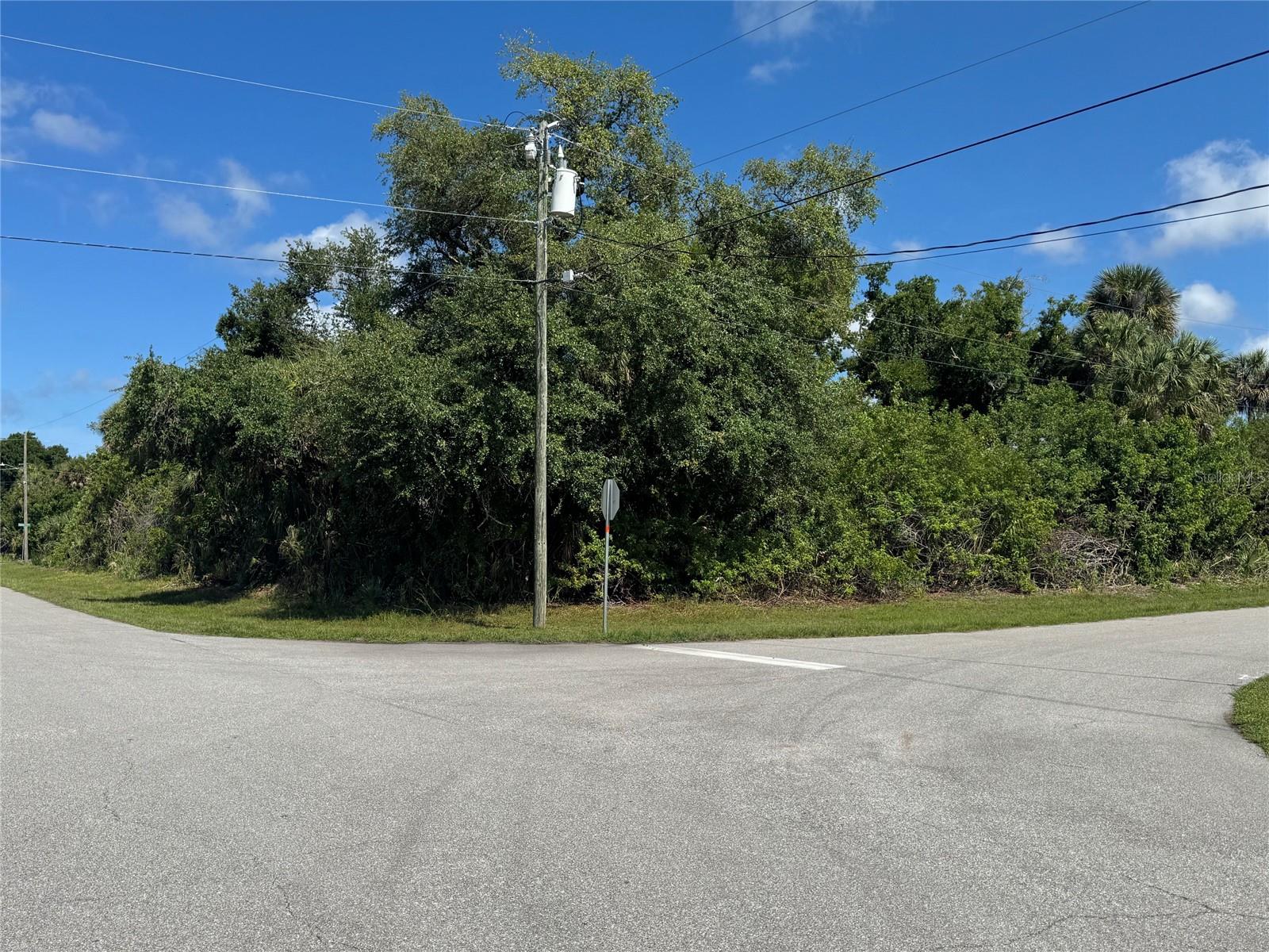 This s a CORNER LOT located in desirable Rotonda Heights with public water and sewer already in place! The perfect opportunity to build your Florida dream home in a growing community close to everything Southwest Florida has to offer. Conveniently located just minutes from dining, shopping, golf courses, parks, boating, and world-class fishing. Enjoy easy access to the beautiful beaches of Boca Grande, Englewood, and Manasota Key, along with nearby community events, entertainment, and waterfront dining. Plus, famous Siesta Key is only about an hour away!