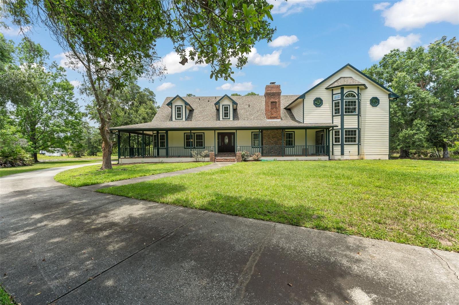 Welcome to this hidden gem situated on a premium 3.29 ACRE LOT  in one of Central Florida’s premier EQUESTRIAN estate community with a LOW HOA - Pickett Downs. This 5 BEDROOM, 3.5 BATH POOL HOME, combines modern comfort with country charm, offering a tranquil setting for those looking for a slice of country living. With 3,903 heated SF, a 2 CAR SIDE-LOAD GARAGE and plenty of storage space, this spacious two-story layout is designed for both comfortable living and easy entertaining.  

Volume ceilings and an abundance of natural light enhance the home's inviting atmosphere, while the split-bedroom layout provides privacy and functionality.  

Generous living spaces include a formal dining room, a welcoming family room centered around a wood-burning fireplace, and a versatile bonus room ideal as a home office, media room, game room, or lounge. Completing this remarkable property is a detached block shed and an impressive list of updates that make this home truly MOVE-IN READY -  2020 ROOF; 2 A/C units with UV Lights 2021 & 2022; 2 Hot Water Heaters 2020; Windows by Andersen 2021; Diamond Bright Pool Resurfacing 2016; Pool Deck Refinishing 2024; Pool Pump 2026, Garage Door 2025, Refrigerator, Stove and Microwave 2026; Dishwasher 2023; Exterior painting 2020; carpet, ceiling fans, garage lights 2026; primary bedroom deck railing replacement 2023. The property has also been maintained with several service agreements and added peace-of-mind features. Radon testing was completed in 2023 with results well below actionable limits. The well and water softener equipment are under a quarterly service and maintenance agreement with KLR Well Drilling, the A/C units are under a maintenance agreement with American Air & Heat, and pest control plus a transferable termite bond are in place with Turner Pest Control 

The spacious primary suite serves as a private retreat, featuring two custom walk-in closets, direct access to a balcony, and an en-suite bath complete with dual sinks, a soaking tub, and a walk-in shower. Four additional generously sized bedrooms provide plenty of comfort and privacy for family members and guests.  

The interior laundry room offers added convenience with a washer and dryer, utility sink, and abundant cabinet storage. The kitchen, with a timeless appeal, features custom cabinetry, plenty of counter space, and a breakfast bar, while the adjoining dining nook overlooks the pool and expansive backyard, creating a serene setting for everyday meals.  

The outdoor space is an entertainer’s dream with the pool, a large screened patio and acres of green space—ideal for expanding, customizing, or simply enjoying peaceful, secluded surroundings. The lifestyle here extends well beyond the property itself, with deeded access to a bridle trail, access to Lake Pickett with a private boat ramp and dock, and convenient access to Downtown Oviedo’s shopping, dining, and local favorites. If you are looking for space, natural beauty, and outdoor recreation while still being close to everyday conveniences, this home presents a rare opportunity to enjoy an elevated Florida lifestyle in a desirable Chuluota community!  **This house comes with a REDUCED RATE through the seller's preferred lender. This is a lender-paid rate buydown that reduces the buyer's interest rate and monthly payment.**