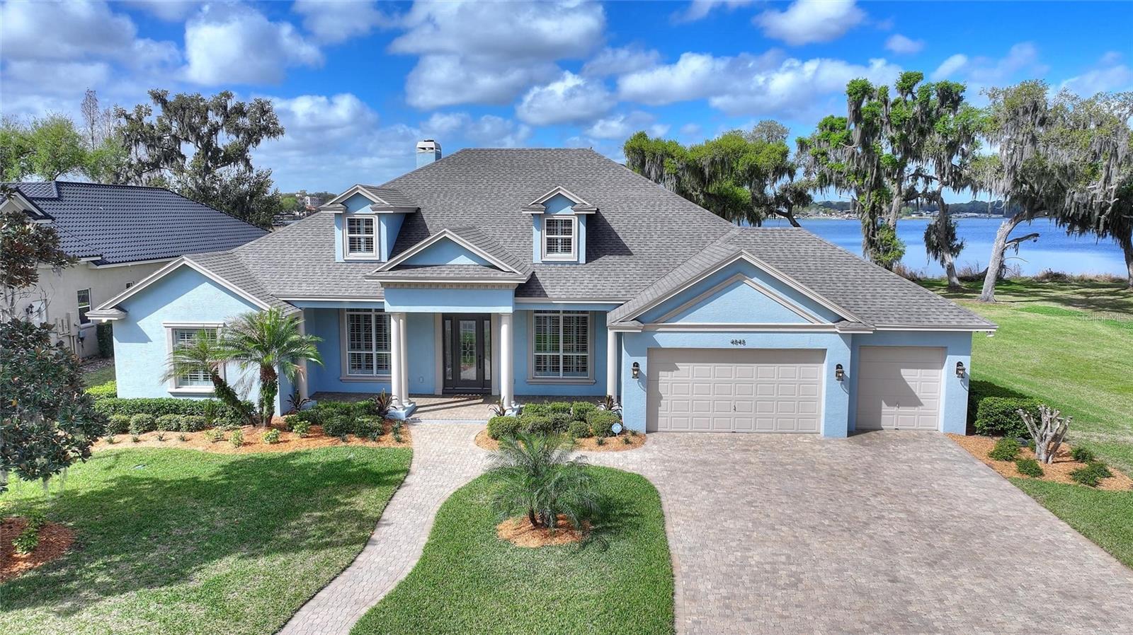 NEWLY REMODELED 5 BEDROOM, 4 BATHROOM LAKEFRONT POOL HOME SITUATED ON A GENEROUS (.70) ACRE LOT LOCATED IN LAKELAND, FL!!!  Welcome to your custom waterfront retreat in the highly sought after gated community of Lake Gibson Shores.  The quality and workmanship of the renovations will not disappoint!  The most notable updates of this home include:  NEW ROOF-2025, LUXURY VINYL PLANK FLOORING THROUGHT-2026, QUARTZ COUNTERTOPS AND BACKSPLASH IN KITCHEN-2026, NEW SCREEN PANELS IN POOL ENCLOSURE-2026, INTERIOR/EXTERIOR PAINT-2026, TOUNGE AND GROOVE CEILINGS ON BACK PATIO AND FRONT ENTRYWAY-2025, SEVERAL LIGHTING FIXTURES-2026 AND ALL DRIVEWAY/POOL AREA PAVERS CLEANED, SANDED AND SEALED-2026!!!  Upon entering you will be greeted with soaring ceilings and an abundance of natural light.  As you make your way past the formal areas into the great room you will be astonished by the serene pool/spa and lake views and beautiful double fireplace.  The adjoining eat-in kitchen features an abundance of hardwood cabinetry with new hardware, beautiful countertops, center island with wine refrigerator, and walk-in pantry with built-in shelving.  The primary en-suite is oversized and features trayed ceilings, crown molding, canned lighting and a cozy fireplace.  The walk-in closet in the primary bedroom is massive and features hardwood built-ins and leads to a large bathroom with jetted tub and exercise area.  This home boasts a triple split floorplan and also a large bonus room for complete privacy.  All other bedrooms are a generous size, and all bathrooms include granite countertops.  Don't forget about the outdoor summer kitchen!  Equipped with a built-in grill, gas cooktop, refrigerator, sink, ice maker and granite bar top, your family and friends will surely make plenty of great memories here.  The composite dock is covered and has multiples lifts to accommodate your boat and all your water toys!  The sunset from the rear of this property is truly breathtaking.  A few other features worth mentioning are:  central vac, in-wall pest control, epoxy coated garage floors and whole house surround sound.  The bonus room would make a great movie/media area.  This custom home is conveniently located in close proximity to I-4, which is the major corridor between Tampa International and Orlando International Airport. Florida Polytechnic University is just a short drive and is the only public university dedicated exclusively to STEM (Science, Technology, Engineering, and Math).  The nearby Circuit Florida is a high-end motor sports resort and features luxury condominiums and attracts car enthusiasts from all over the world!  Shopping, restaurants and medical are also within close proximity.  Don't miss an opportunity to own this true lakefront oasis, one that's away from it all, but yet so close to everything.