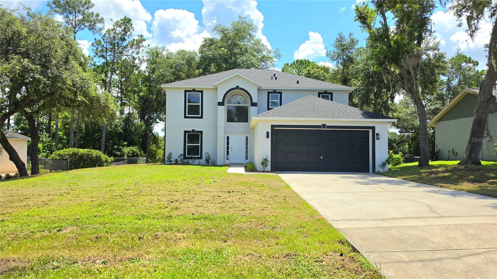 Move-In Ready with Modern Updates and a Brand-New Roof!

Welcome to this beautifully updated two-story home featuring 4 bedrooms, 2.5 bathrooms, and over 2,200 square feet of living space. Recent upgrades include a brand-new roof, new interior and exterior paint, remodeled bathrooms, and new flooring, making this home truly move-in ready.

Enjoy the spacious layout with separate living and dining areas, a 2-car attached garage, and a large fenced backyard with peaceful lake views—perfect for relaxing or entertaining family and friends.

Located in the desirable Deltona Lakes community with no HOA, this home offers comfort, space, and exceptional value.

Schedule your private showing today! Motivated seller—don't miss this incredible opportunity.

Listing agent is related to the seller.
