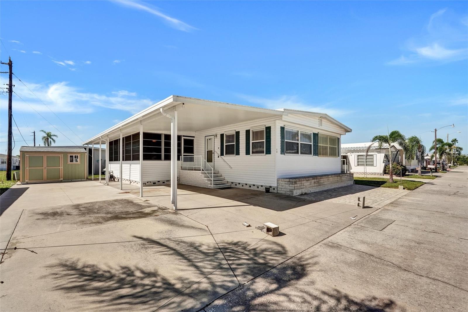Welcome to Paradise Bay Estates — a premier 55+ waterfront community along the shores of Sarasota Bay, just 2 miles from the sparkling beaches of Anna Maria Island! This beautifully updated 2BR/2BA home offers a bright, open floor plan and a spacious Florida Room perfect for relaxing or entertaining. Expanded parking pad with room for your boat and two convenient storage sheds provide plenty of space for all your coastal living essentials.

Paradise Bay Estates is alive with activities and friendly faces — offering golf and kayak trips, dances, live shows, and potluck dinners at the clubhouse. Enjoy monthly “Music on the Bay” events, sunset gatherings in the waterfront gazebos, and an active social calendar filled with fun and connection. Community amenities include a heated pool and spa, shuffleboard and pickleball courts, library, and fishing pier.

Whether you’re soaking up the sun, joining friends for a waterfront concert, or enjoying quiet time in your Florida Room, this home and community deliver the best of the Gulf Coast lifestyle — welcoming, vibrant, and just minutes to everything Anna Maria Island has to offer.