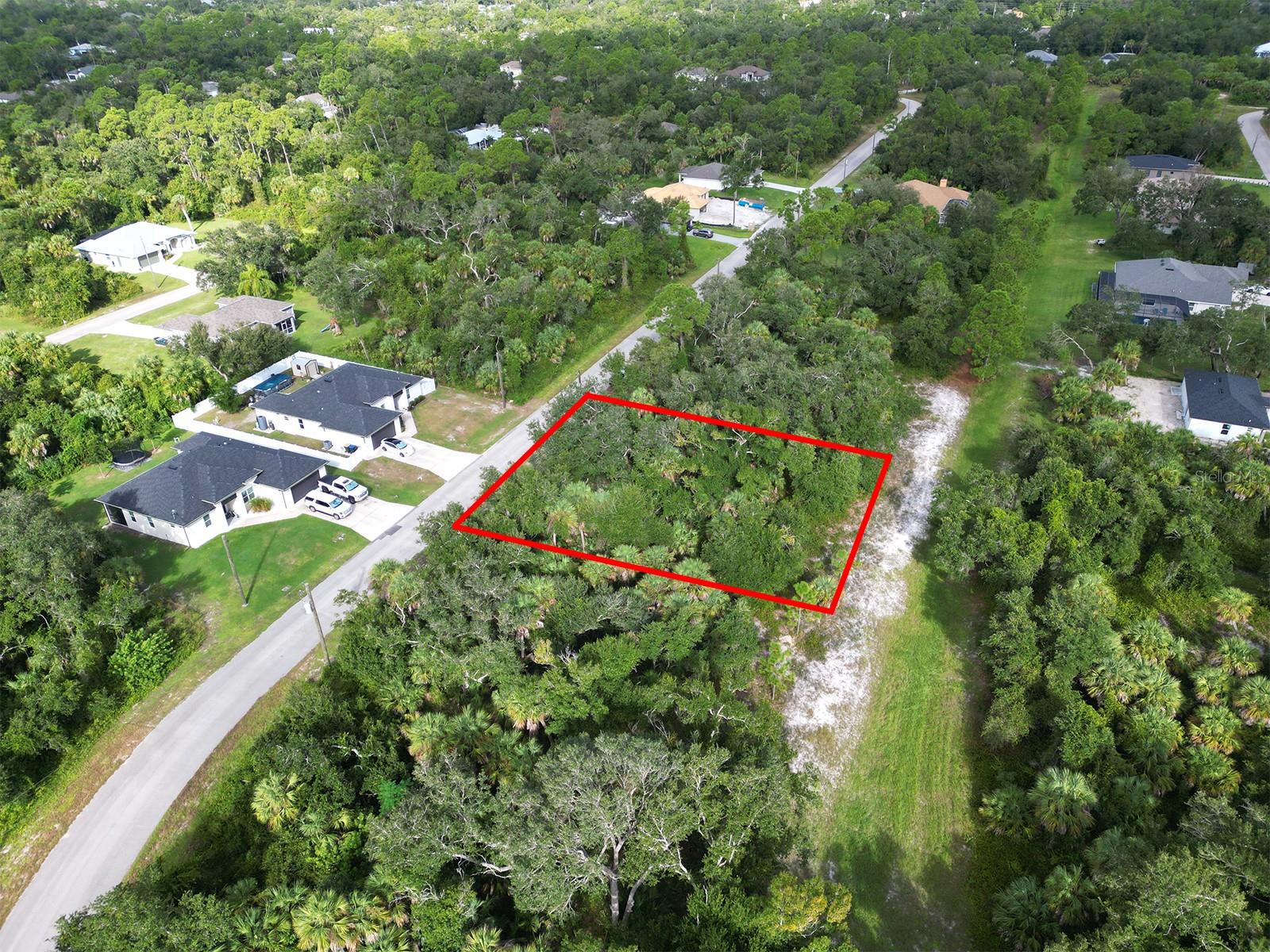Build your dream home on this slightly oversized residential lot in the growing city of North Port, Florida. Located on Rhapsody Ave, this buildable vacant lot measures approximately 83x126, offering more flexibility than a standard single lot and giving future homeowners additional space for a larger floor plan, garage, driveway, lanai, pool, or outdoor living area. One of the strongest features of this property is the private greenbelt backdrop. Instead of backing directly up to another home, this lot offers a natural wooded buffer behind the property, creating added privacy, separation, and a peaceful backyard setting. The surrounding neighborhood is already seeing continued growth, with newer homes nearby and additional new construction popping up down the road. This property is located in a no flood zone, making it an attractive option for buyers, builders, investors, or anyone looking to secure land in Southwest Florida. Enjoy convenient access to Toledo Blade Blvd, with nearby shopping and dining including the brand-new Starbucks, Publix, Wawa, restaurants, schools, parks, medical facilities, and everyday conveniences. North Port is one of the fastest-growing cities in Southwest Florida, known for its residential growth, proximity to Wellen Park, Port Charlotte, Venice, Sarasota, Warm Mineral Springs, golf courses, Gulf beaches, and major roadways.

Whether you are looking to build a primary residence, hold land as a long-term investment, or develop a future spec home, this oversized greenbelt lot offers a strong combination of location, privacy, size, and buildability in the heart of North Port.