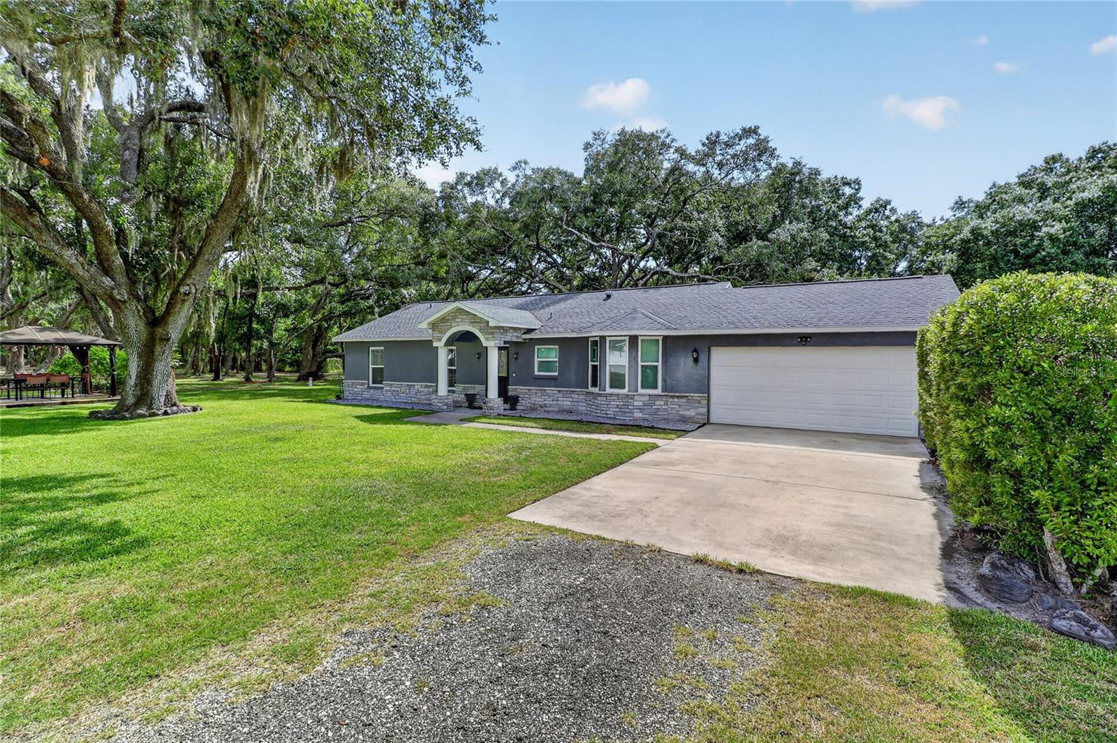 Charming 3-Bedroom Home on Over an Acre in Odessa, Family owned and meticulously cared for over 20 years.
Escape the hustle without leaving the convenience of the Tampa Bay area. Nestled on a sprawling 1.32-acre lot, this 3-bedroom, 2-bathroom home offers the space and privacy today's buyers are searching for — all within this sought-after Odessa, FL neighborhood.
With 1,333 square feet of comfortable living space, this property is ideal for those who value room to breathe. The primary suite with a large Full bathroom and walk-in closet are situated on the opposite side of the home from secondary bedrooms and bathroom, giving you privacy from guests and family. Newer updates and fixtures with a modern feel. The front of the home has all new impact windows installed in 2024. Roof was replaced in 2016 and a new water softener was just installed in February 2026. Private well and septic on property maintained by the owner. The generous lot provides endless potential - whether you're dreaming of a pool, a workshop, a garden, animals or simply wide-open space to call your own. Built in 2001, the home offers a solid foundation with room to personalize and update to your taste. Don't miss this opportunity to own a piece of Odessa's coveted countryside at an exceptional value. Dining room chandelier does not convey.
This property has the ability to be sold with it's adjacent sister property (4 bed/2 bath on 2.12 acres - making the total property over 3 acres with 2 houses on it plus the shed) Ask listing agent for details.
**Contact listing agent to schedule showings. Listing agent must accompany.**
Seller will complete the necessary Letter of Map Amendment (LOMA) process with FEMA and obtain any required documentation, elevation information, and verification from Hillsborough County regarding the property’s current flood zone designation. The purpose of this process is to seek an amendment to the FEMA flood map designation and obtain FEMA confirmation regarding the property’s removal from the AE flood zone designation, if supported by the required elevation documentation.

Upon completion of the review, Hillsborough County will provide and/or transmit updated floodplain information to FEMA for consideration in updating the applicable FEMA flood maps. The parties acknowledge that the current FEMA flood maps have not been updated since 2008 and may not reflect current property conditions, improvements, or elevation information.