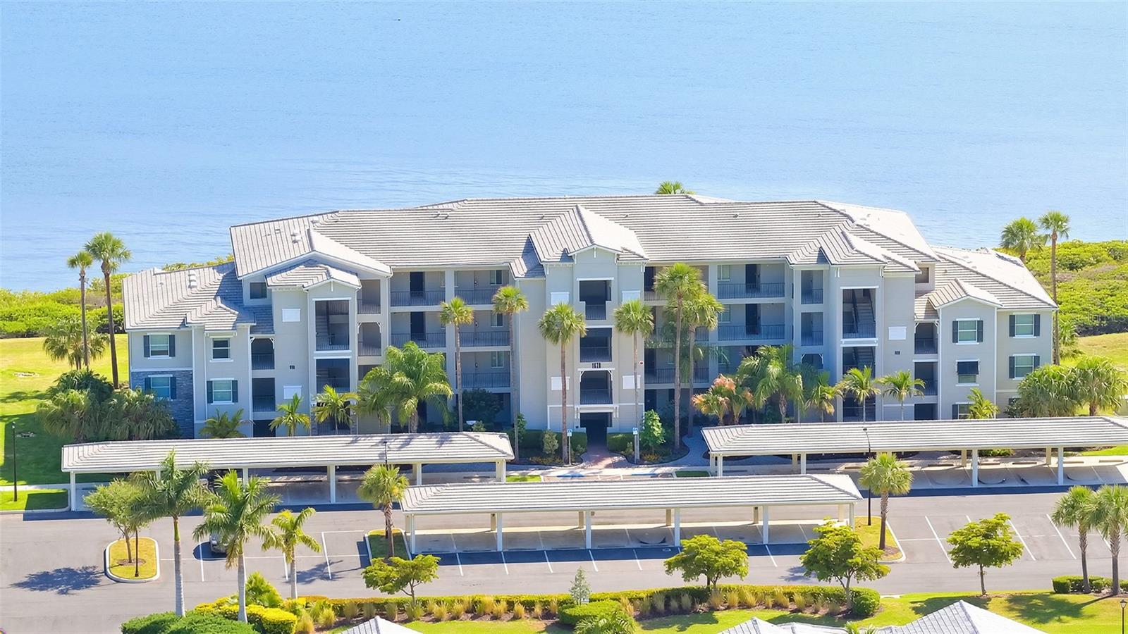 Experience waterfront living in Tidewater Preserve with this fully furnished two-bedroom, two-bath residence overlooking the Manatee River. Offering year-round water views and a move-in-ready lifestyle, this beautifully appointed home combines thoughtful features with an exceptional collection of resort-style amenities in one of Bradenton’s sought-after gated communities. The open-concept floor plan features tile flooring throughout the main living areas, crown molding, built-in dining seating and a spacious kitchen with quartz countertops, shaker-style cabinetry, pendant lighting, stainless steel appliances and an oversized island designed for everyday living and entertaining. Reverse osmosis and whole-house water filtration systems add everyday convenience and functionality. The screened lanai provides a comfortable setting to relax with morning coffee or unwind while enjoying tranquil river views and colorful sunsets. An assigned covered parking space and private storage area complete the residence. Life at Tidewater Preserve extends well beyond your front door with three resort-style pools, two clubhouses, two well-equipped fitness centers, tennis courts, scenic riverfront recreational trails, a dog park, kayak launch and private marina with boat slips and lifts available for boating enthusiasts with direct access to the Manatee River. The gated community also offers 24-hour security, an on-site lifestyle director, and beautifully maintained grounds. Ideally near shopping, dining and entertainment, this residence is also less than 30 minutes from the beaches of Anna Maria Island, offering convenient access to some of Florida’s desirable coastal destinations. Maintenance-free living with HOA fees covering lawn care, landscaping, water, sewer, trash, flood insurance, internet and an expanded cable package. Also includes an assigned covered carport parking spot just outside the building. Whether you are searching for a full-time residence or seasonal retreat, this furnished waterfront home offers an exceptional opportunity to enjoy the Florida lifestyle from day one.