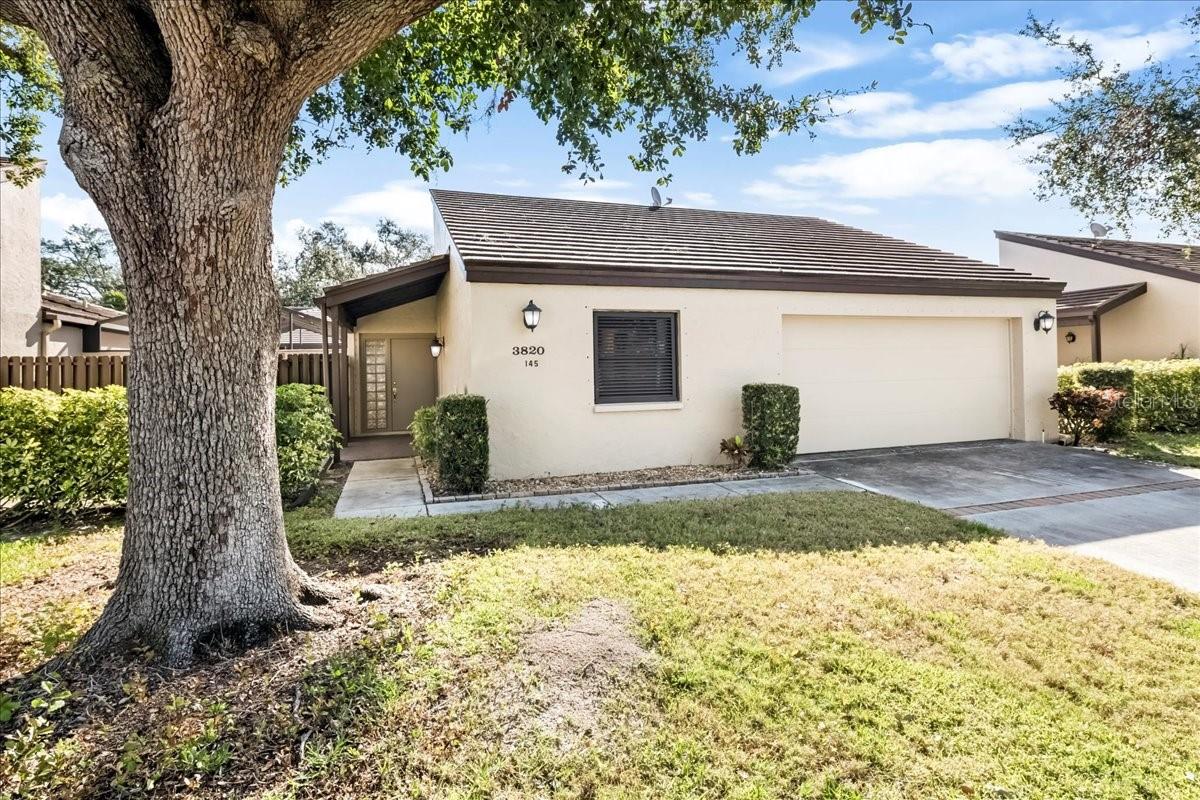One or more photo(s) has been virtually staged. Priced to sell, one of the best values in Glen Oaks Manor. Welcome to this well-maintained 2-bedroom, 2-bathroom home located in the desirable Glen Oaks Manor community of Sarasota. This move-in ready home offers a functional open layout with tile flooring and fresh neutral finishes throughout. The kitchen includes ample cabinet storage and generous counter space which flows into the living and dining areas for easy, everyday living. Both bedrooms are comfortably sized, with the primary bedroom offering a renovated en-suite bathroom. Sliding glass doors lead to a private screened courtyard, perfect for relaxing or entertaining with minimal maintenance. Additional features include a two-car garage, neat landscaping, and a quiet neighborhood perfect for year-round living or seasonal residence. Conveniently located, it is just a 4-mile drive to downtown Sarasota and a 5-mile drive to University Town Center, St. Armands, and Lido Key Beach.