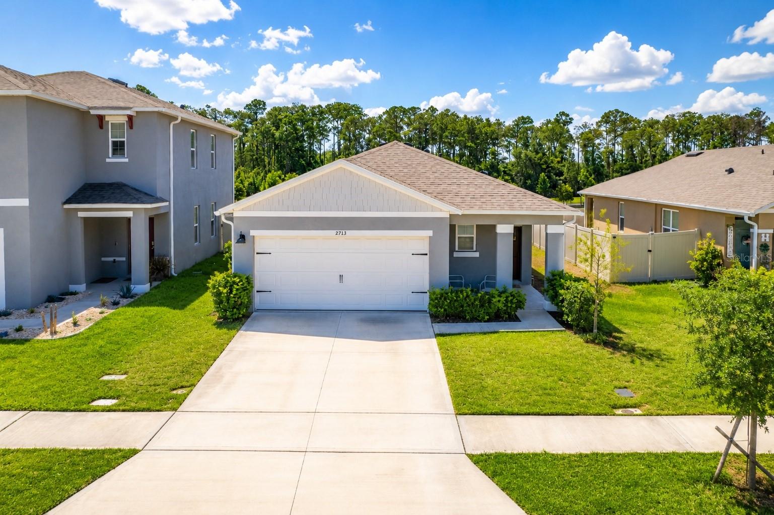 Welcome to this beautifully maintained 3-bedroom, 2-bathroom home located in the highly desirable Harmony West community. Built in 2023, this move-in-ready home offers a modern open-concept floor plan with a spacious living area, a well-appointed kitchen featuring stainless steel appliances, ample cabinet space, and a large island perfect for entertaining.

The private owner's suite features a walk-in closet and an en-suite bathroom with dual sinks. Two additional bedrooms provide flexibility for family, guests, or a home office. Enjoy outdoor living in the fully fenced backyard with plenty of space for relaxation, pets, or play.

Residents of Harmony West enjoy resort-style amenities including a community pool, clubhouse, fitness center, playgrounds, walking trails, and scenic green spaces. Conveniently located near major highways, Lake Nona, Medical City, Orlando International Airport, shopping, dining, and top-rated schools.

Don't miss this opportunity to own a newer home in one of Central Florida's fastest-growing communities. Schedule your private showing today!