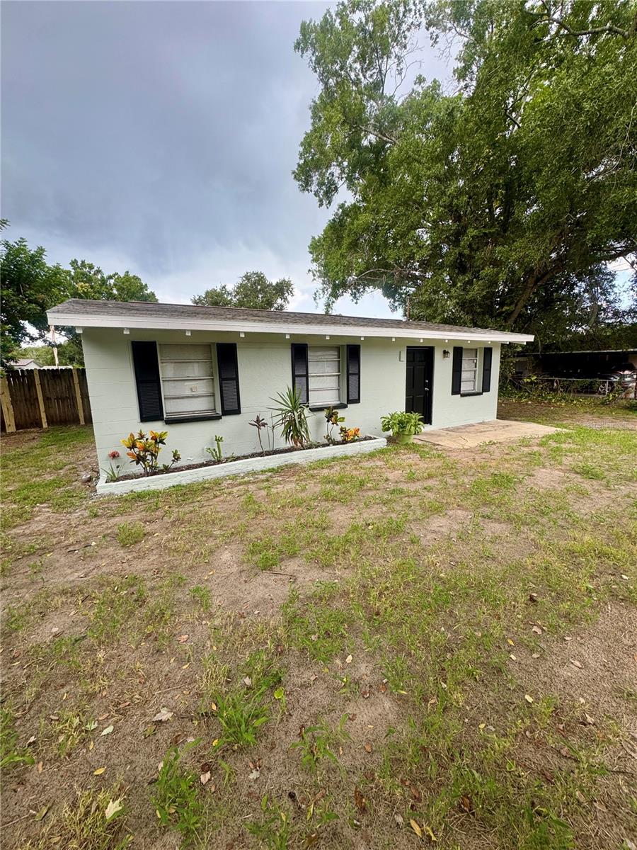 Don't miss your chance on this cute and cozy (and completely redone!) Town N' Country gem! Situated in an established neighborhood with no HOA, this home checks all the boxes and offers peace of mind for years to come! Enjoy the freshly painted exterior, mature landscaping, and fruiting trees, and fenced backyard from the moment you pull up. The inside has also been freshly painted and features brand new LVP flooring throughout for ease of upkeep, updated fixtures, new vanity in bathroom, and a brand new kitchen with stainless steel appliances overlooking your living area so you never miss a thing! NEW ROOF 3/26, NEW Septic, and just finished getting tied into public water! AC replaced in 2023! Convenient to W Hillsborough Ave, Memorial Hwy, Veteran's Expressway, Tampa International Airport, Aldi, Home Depot, Publix and more!