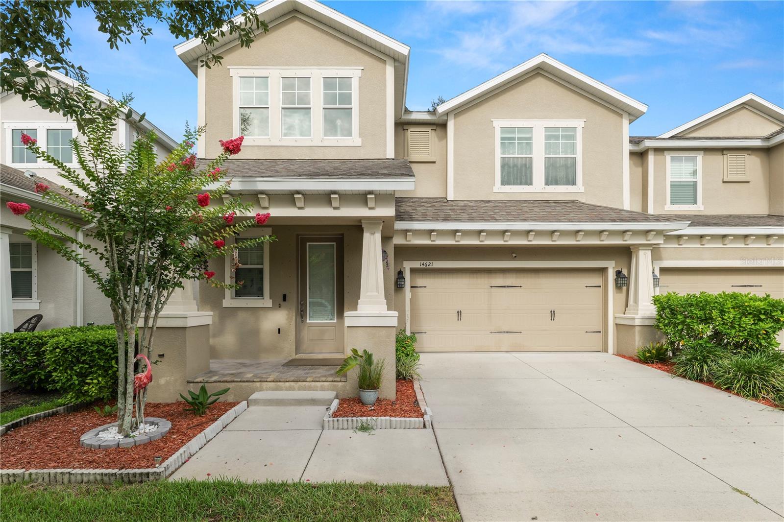 Welcome to this beautifully upgraded 3 bedroom, 3 bathroom end unit townhome situated on a premium lot, offering exceptional curb appeal and modern finishes throughout. The exterior features attractive concrete paver accents on the front porch, a screened in lanai perfect for relaxing or entertaining, St. Augustine grass with a full irrigation system, and a backyard play area enhanced with low maintenance artificial turf. The spacious 2 car garage includes durable epoxy flooring and overhead storage racks for added convenience.

Step inside to an open concept floor plan designed for both everyday living and entertaining. The first floor welcomes you with a grand foyer featuring soaring ceilings and a modern light fixture. The expansive living and dining areas flow seamlessly into the well appointed kitchen, complete with a large center island with sink, granite countertops, tile backsplash, cabinetry with crown molding, stainless steel appliances, and a walk in pantry equipped with storage racks. An additional flex space offers the perfect setting for a home office or formal dining room. The first floor bedroom features new tile flooring and a ceiling fan, while the adjacent full bathroom showcases an upgraded shower, granite countertop, and single vanity.

Upstairs, you'll find a versatile loft area ideal for a second living space, media room, or study area, along with a separate laundry room featuring additional storage. The spacious primary suite boasts elegant tray ceilings, a large walk in closet, dual vanity sinks, and a walk in shower. The third bedroom offers a walk in closet and private en suite bathroom, providing comfort and privacy for guests or family members.

A major investment has already been made for the next owner with approximately $30,000 in new flooring installed throughout the entire home in 2026. Combining premium upgrades, thoughtful design, and a desirable end-unit location, this move in ready home is a must-see.
