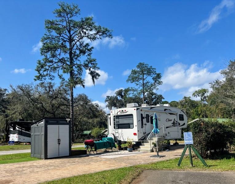 .. COME ENJOY THE EASY LIVING AT THE SALT SPRINGS RESORT ELITE! DEEDED PULL THRU LOT - COMPLETE PACKAGE DEAL - Salt Springs Resort has its own boat launch into little Lake Kerr and connects to big Lake Kerr for the fishermen or water activities! Not to mention all the nearby trails for hiking and adventure! Take a day trip and head to the beach, Daytona beach est. 45mins away!  Make this your weekend getaway or permanent home. Better yet Airbnb to make some extra cash. Only 40 minutes from Ocala FL & 23 miles to Palatka FL.. At the end of the day enjoy a swim in the 2 huge pools or shoot some horseshoes, play pickleball or basketball. This resort offers plenty of amenities that will keep you busy. The 2011 Cougar unit will remain on the  property.