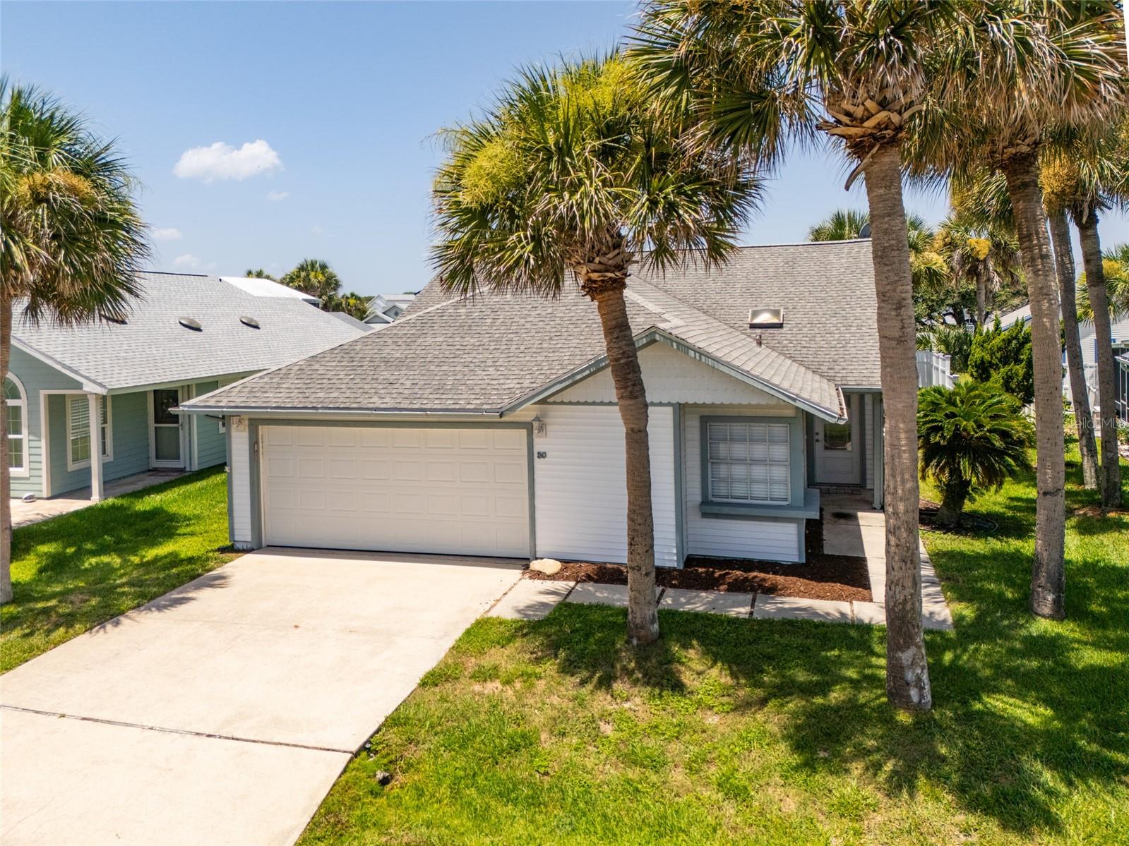Look at this price for a cozy beach cottage with a beautiful view of a lake and ONE block to OCEAN, Community clubhouse, heated pool and spa. Sit on the walkover by the pool with your coffee watching the sunrise. Then walk your fur baby on the beach to collect those treasures. Golf carts allowed to tour the community and meet the neighbors. This community sits next to the County park with look out towers for whale and dolphin watching, jog and bike paths. 5 minutes to the intracoastal waterway to the marina to drop in your boat jet ski.  or just fish off the piers. Close to grocery stores, restaurants. 30 minutes to Historic St. Augustine for fine dining or tours and 30 minutes south to Daytona speed way for NASCAR and bike week. LOCATION LOCATION! Great investment property! Snowbirds welcome! If you wish to relax but be able to be on the beach in 5 minutes this is the home for you. Don't snooze on this one!