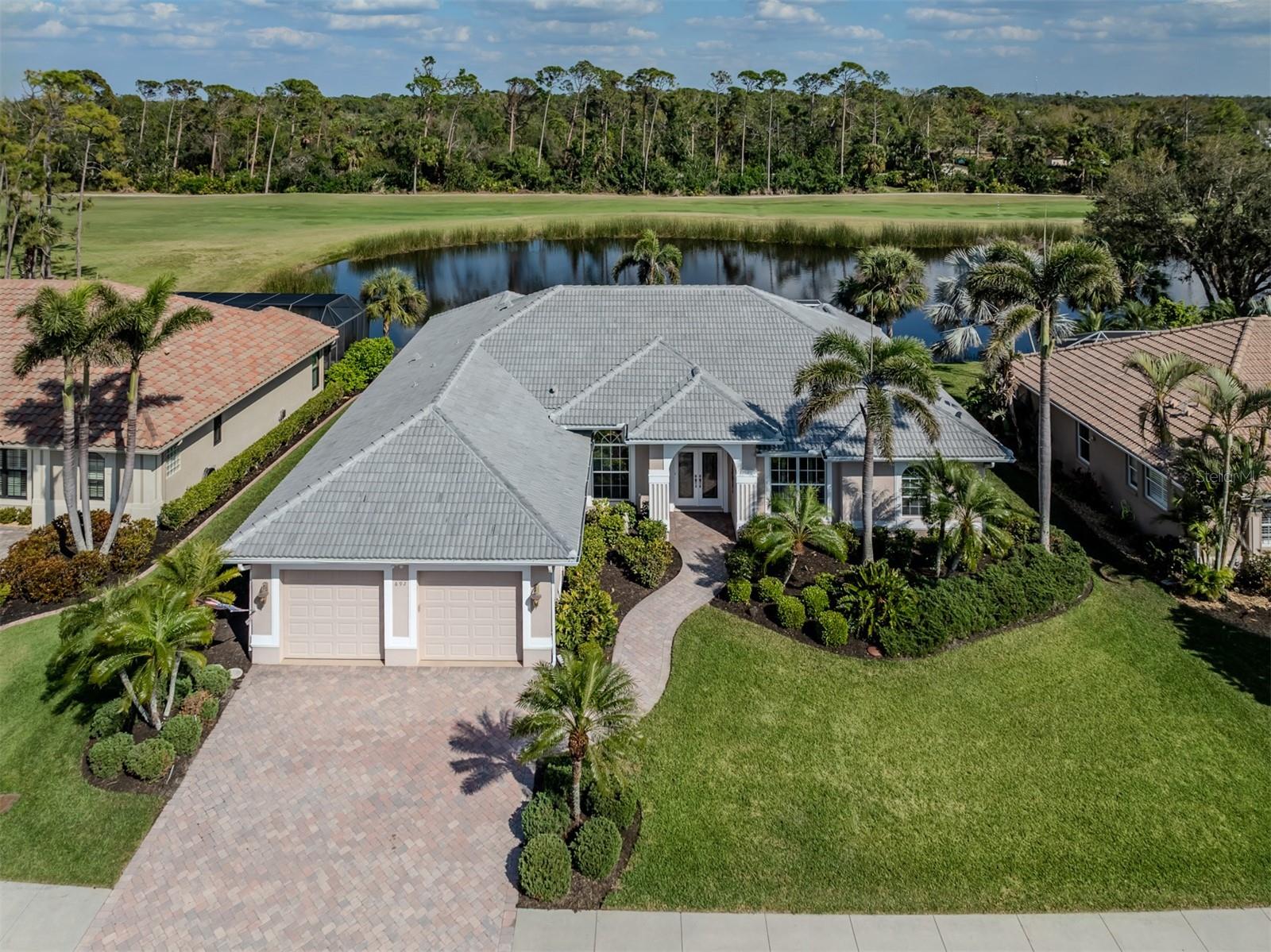 Now is the time to get a special price on this fine house. A serious price adjustment has taken place, so don't miss the chance to come take a look. Located in a premium Lakefront location in popular Sawgrass, one of Venice's highly sought-after golf communities. The hard-to-find 3,200 sq. ft. sized home is a true 3 bedroom/3 full baths plus office, created with a flowing open floorplan. The extra-size kitchen and cafe' area as well as the spacious family room and living room have panoramic lake views and overlook the large pool and caged lanai. You'll find plenty of space to welcome family and friends. Two of the sizable bedrooms and bath are in one wing of the home and the truly masterful primary suite is on the opposite side, offering maximum comfort for all. One of the 3 baths even has dedicated pool access. The TILE ROOF was just replaced as of Feb. 2025, adding extra value and many years of safety ahead. The Sawgrass community has no CDD fees, optional 9 holes of golf, a large, sunshiny pool and resort-style lounging area, various fun sport activities and many social opportunities. Sawgrass is just 4 miles to Venice Island and all that it has to offer, from beaches to bistros to boutiques. This fine home was beloved by its previous owners and their family and has not on the market before, so be sure you don't miss the opportunity!