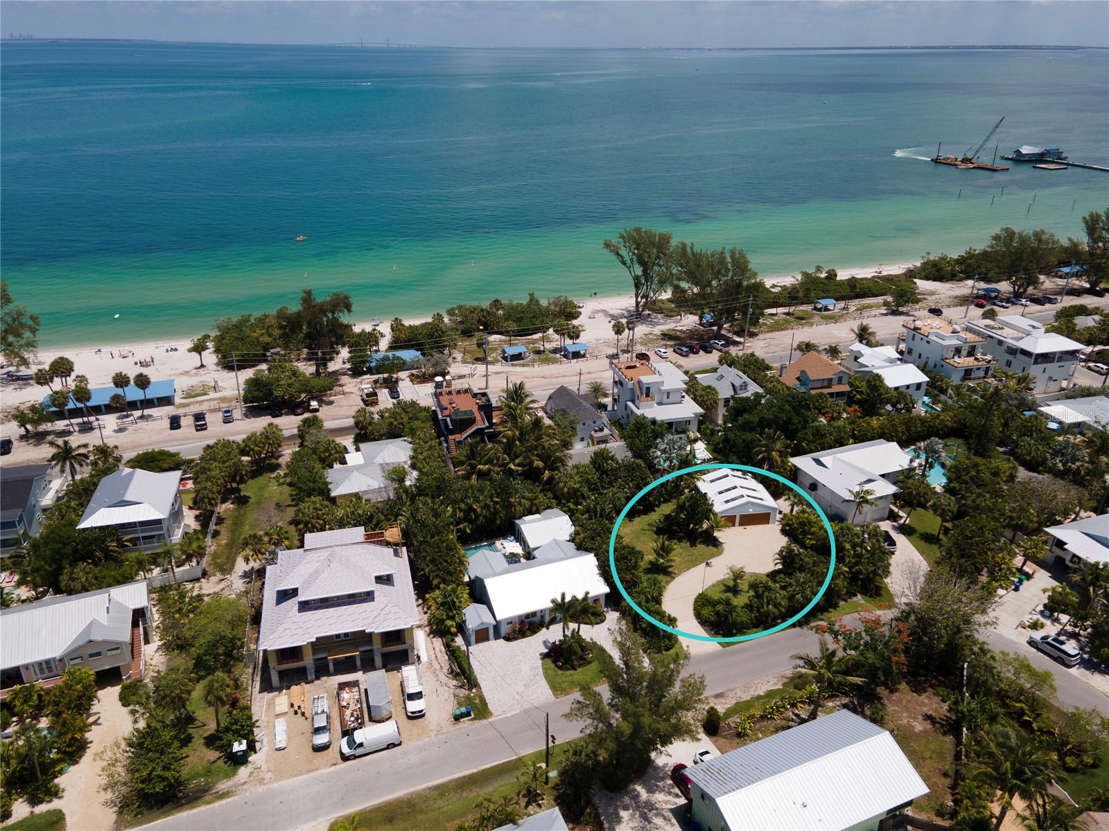 Located on the north end of Anna Maria Island, this 10,600+ square foot parcel is just a short walk from Bean Point beaches, Bayfront Park, and the boutiques and dining on Pine Avenue. The property is beautifully landscaped and includes a large garage, offering a fantastic opportunity to build a custom home with ample space.

If you are not interested in building, the adjacent home at 242 Gladiolus is also available for purchase. Both properties are owned by the same sellers, who currently use this parcel for additional privacy and the existing garage. Purchasing both parcels would provide a rare 18,175 square feet of land on Anna Maria Island.