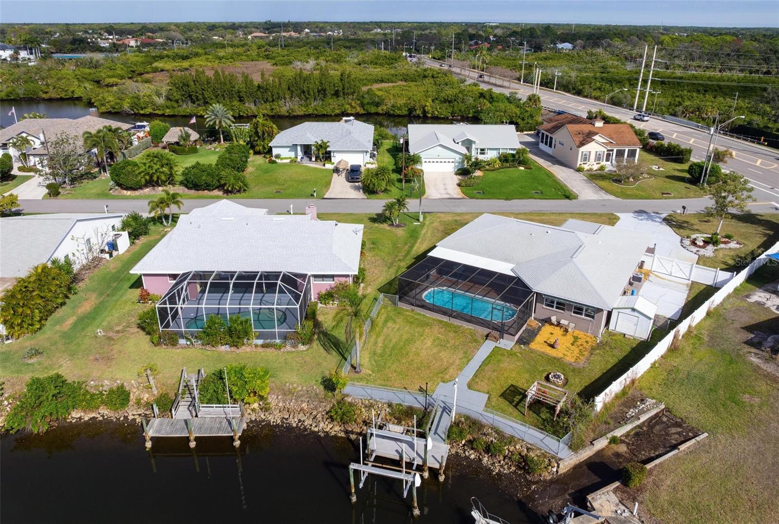 Discover the perfect coastal boating lifestyle in this beautifully updated canal-front home with direct, easy access to the open Gulf waters. This property has stayed completely dry and untouched through every major storm. It features a refreshed dock with a brand-new 10,000-pound boat lift, making this modern waterfront gem truly stand out.
This inviting two-bedroom, two-bath home (with easy modifications available to create a third bedroom) offers an expansive two-car garage, plenty of driveway parking, and a private swimming pool. Located on a generous third-acre lot with no HOA or community fees, it truly embodies relaxed, high-end Florida waterfront living. The roof was replaced in 2022.
Step inside to bright, open interiors with a soft contemporary feel. Recent updates include beautiful coastal-style plank flooring, a gourmet kitchen with premium quartz-like countertops, subtle under-cabinet lighting, high-end Samsung appliances, and custom finishes throughout. The open-concept layout flows naturally from the kitchen into the spacious living areas. Large glass doors in the oversized great room open to the pool and deliver stunning water views from almost every room.
The owner’s suite is generously sized with a refreshed en-suite bathroom. The guest bedroom is tucked away on the opposite side for maximum privacy, featuring a large walk-in closet, private door, and its own updated bath. There’s also a versatile bonus room currently used as a home office with lounge seating and extra space.
Open-water boating is just a quick cruise away — less than three miles. A tall vinyl privacy fence encloses a 32-foot concrete pad, perfect for an RV or boat trailer. Conveniently located less than two miles from Sarasota Memorial Hospital’s Laurel campus and minutes from Nokomis Beach, popular tiki bars, restaurants, and marinas. Nearby Venice offers world-class performing arts, great dining, museums, festivals, the Legacy Trail, golf courses, and 14 miles of public Gulf beaches.
This fully refreshed waterfront home also has strong potential for vacation rentals or income. Furniture is available separately. Come experience this exceptional canal-side retreat for yourself!
