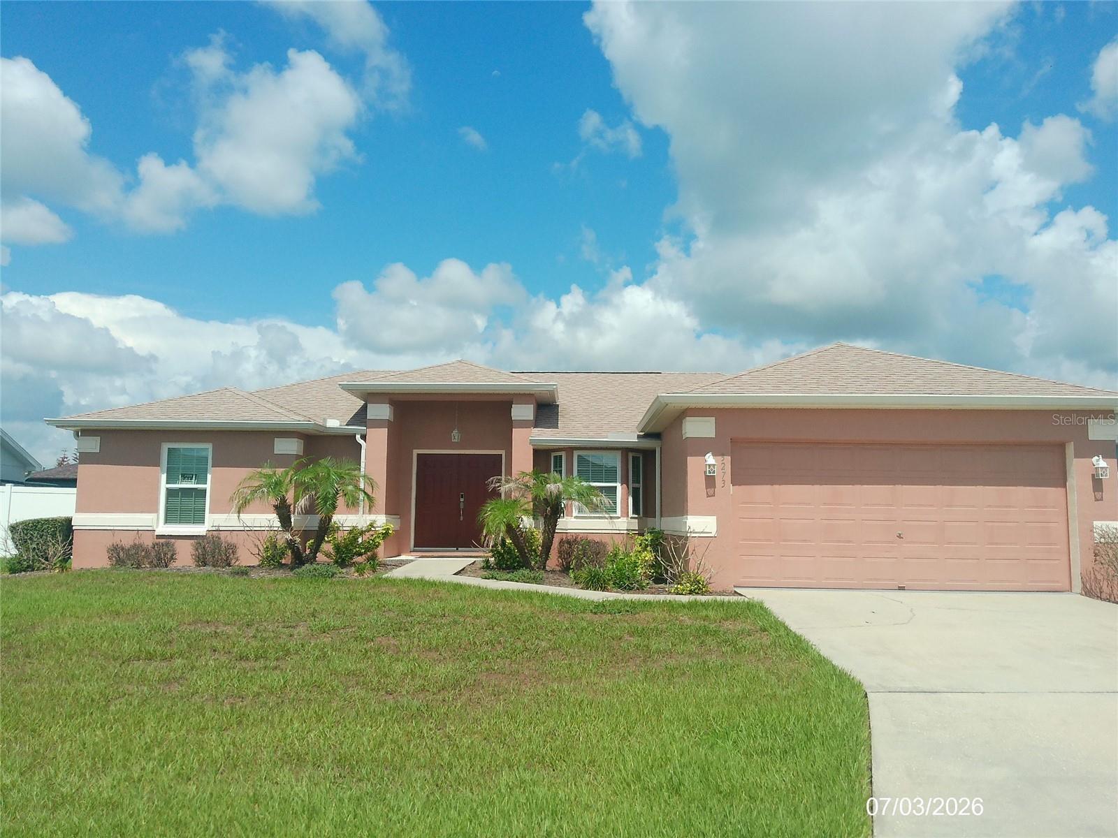 Welcome to this stunning 3-bedroom, 2-bathroom, 2-car garage residence boasts modern interiors and vaulted ceilings, creating an inviting atmosphere flooded with natural light, split Floor plan, eating space in kitchen, upgrades include: new windows and sliding door in 2024, gutters, new roof in 2022, a/c unit in 2022. Appliances in 2025. extra insulation throughout including the garage, step outside to your Vinyl fenced backyard, with ceramic tile flooring throughout the entire home, the primary bedroom featuring dual vanity with walk-in shower no tub, Laundry inside Garage, while the kitchen is a chef's delight with loads of cabinet and countertop space, stainless steel appliances, granite countertops and a separate breakfast nook. The family room is spacious and ready for entertaining, enjoy the convenience of being close to everything you need, from I-4 access to medical facilities, retail centers, and a variety of restaurants. With its prime location easy access to Disney, Tampa and Orlando airports, this home offers the perfect blend of comfort and accessibility.