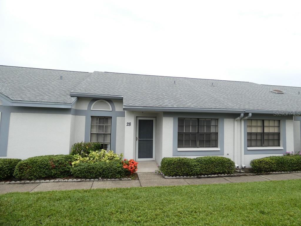 20-foot Vaulted Ceilings, just 28 steps to the Community Pool, This Block Villa Style 2-bedroom & 2-bath, One-Story Condo. The open, airy Floor Plan is Filled with a Friendly Relaxing Atmosphere, Just Like Being on Vacation, Enjoy True No-Maintenance Living with Total Lawn Care and roof maintenance covered by the HOA. No rear neighbors, Villa Living in Zone X (non-flood zone) according to county records, this is a rare opportunity, as a vaulted-ceiling villa in this community has not been available for years. Whether you're looking for a full-time residence or a getaway, this move-in-ready, maintenance-free vaction retreat is ready for only one lucky Buyer. Please view both videos: Tour 1 and Tour 2.